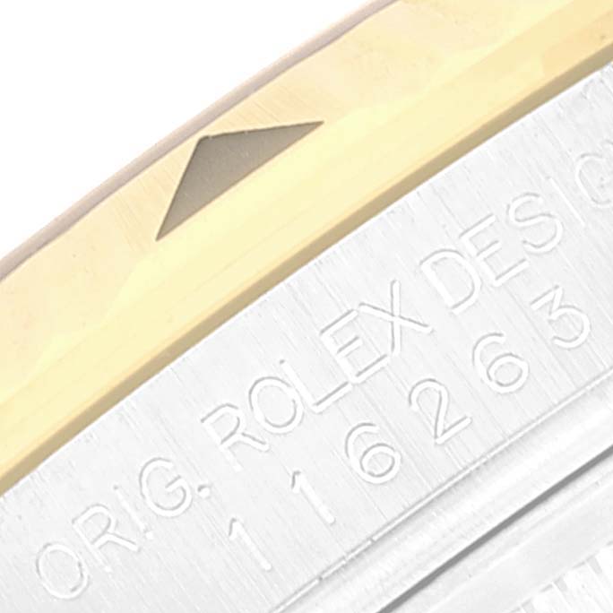 The image shows a close-up of the bezel and engravings on a Rolex Turn-o-Graph 116263 Men
s Steel and Gold (two tone) Grey Dial 116263 Men
s Steel and Gold (two tone) Grey Dial model watch.