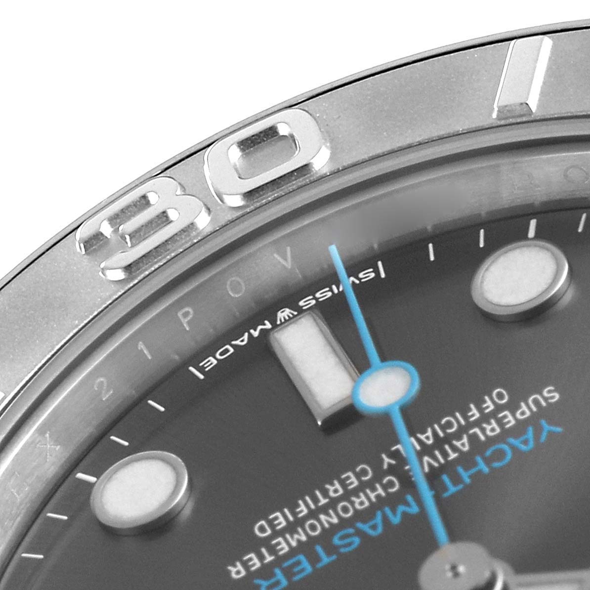 This close-up image of the Rolex Yacht-Master 268622 Men's Stainless Steel Grey Dial 268622 Men's Stainless Steel Grey Dial watch shows part of the bezel, dial, and minute hand at an angled view.