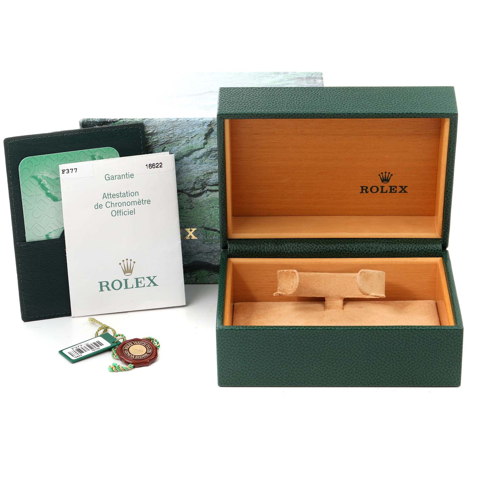 The image shows the accessories for a Rolex Yacht-Master 16622 Men's Stainless Steel Silver Dial 16622 Men's Stainless Steel Silver Dial, including an open box, a warranty card, a booklet, and tags.