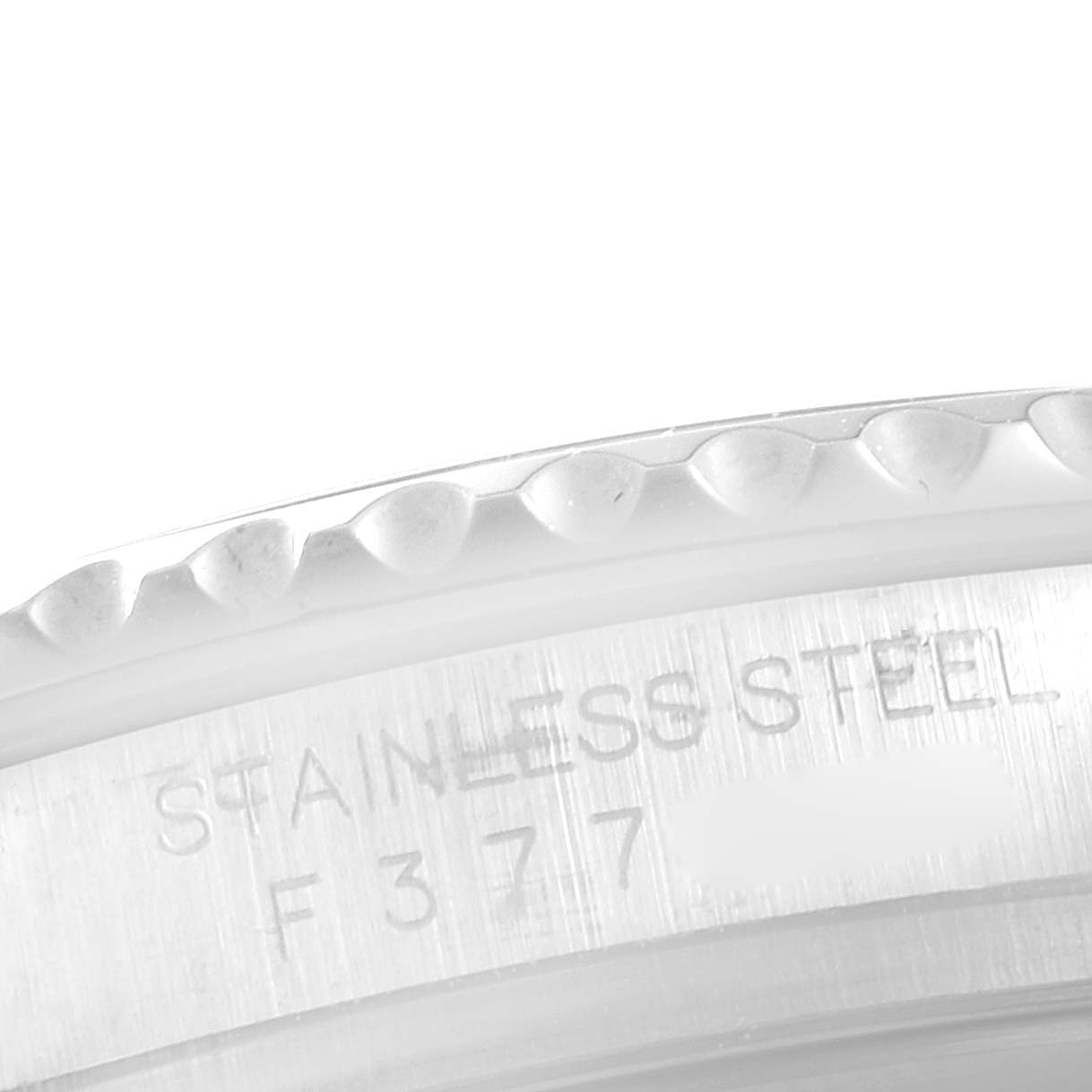 This image shows a close-up of the bezel and outer casing of a Rolex Yacht-Master 16622 Men's Stainless Steel Silver Dial 16622 Men's Stainless Steel Silver Dial with "Stainless Steel" engraved.