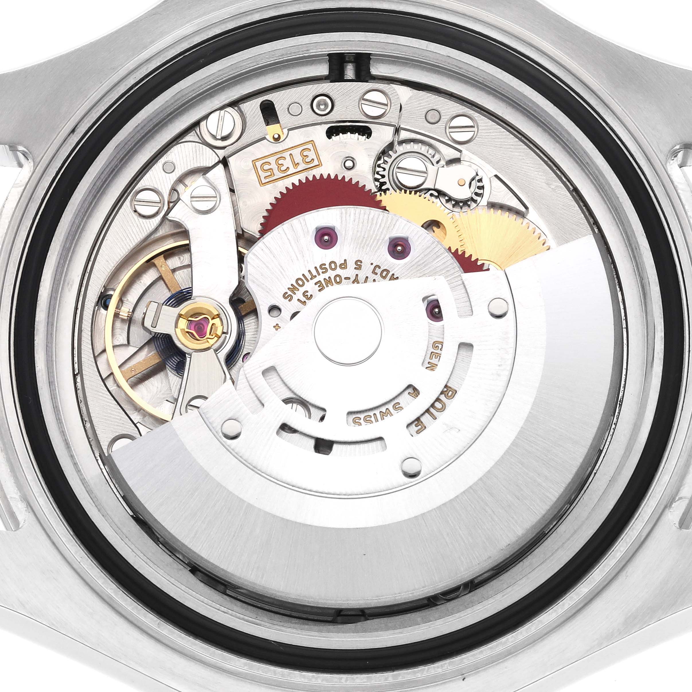 The image shows the movement of a Rolex Yacht-Master 116622 Men's Stainless Steel Grey Dial 116622 Men's Stainless Steel Grey Dial watch from a top-down angle, highlighting gears and rotor.