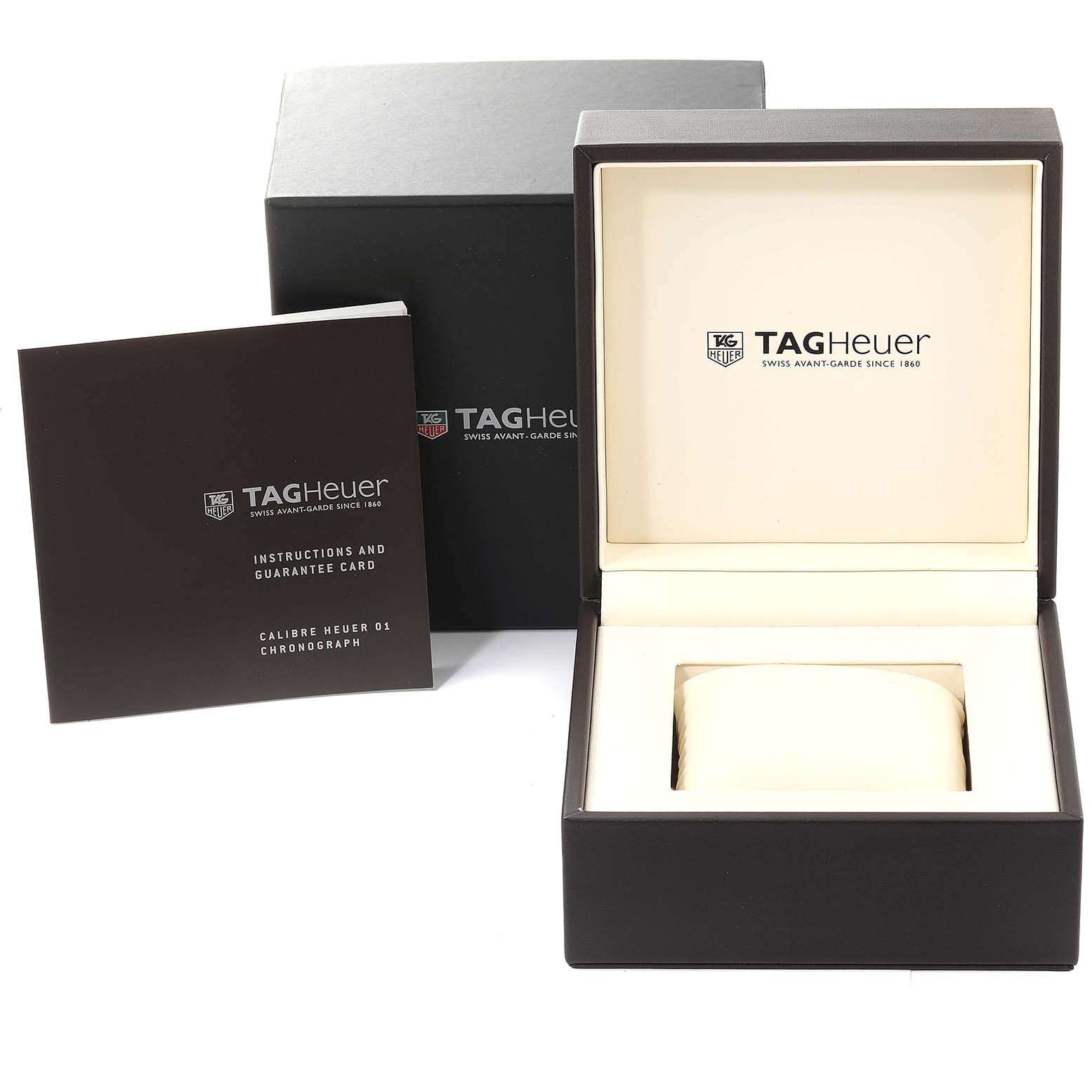 The image shows the packaging, instruction manual, and watch box for a Tag Heuer Carrera model.