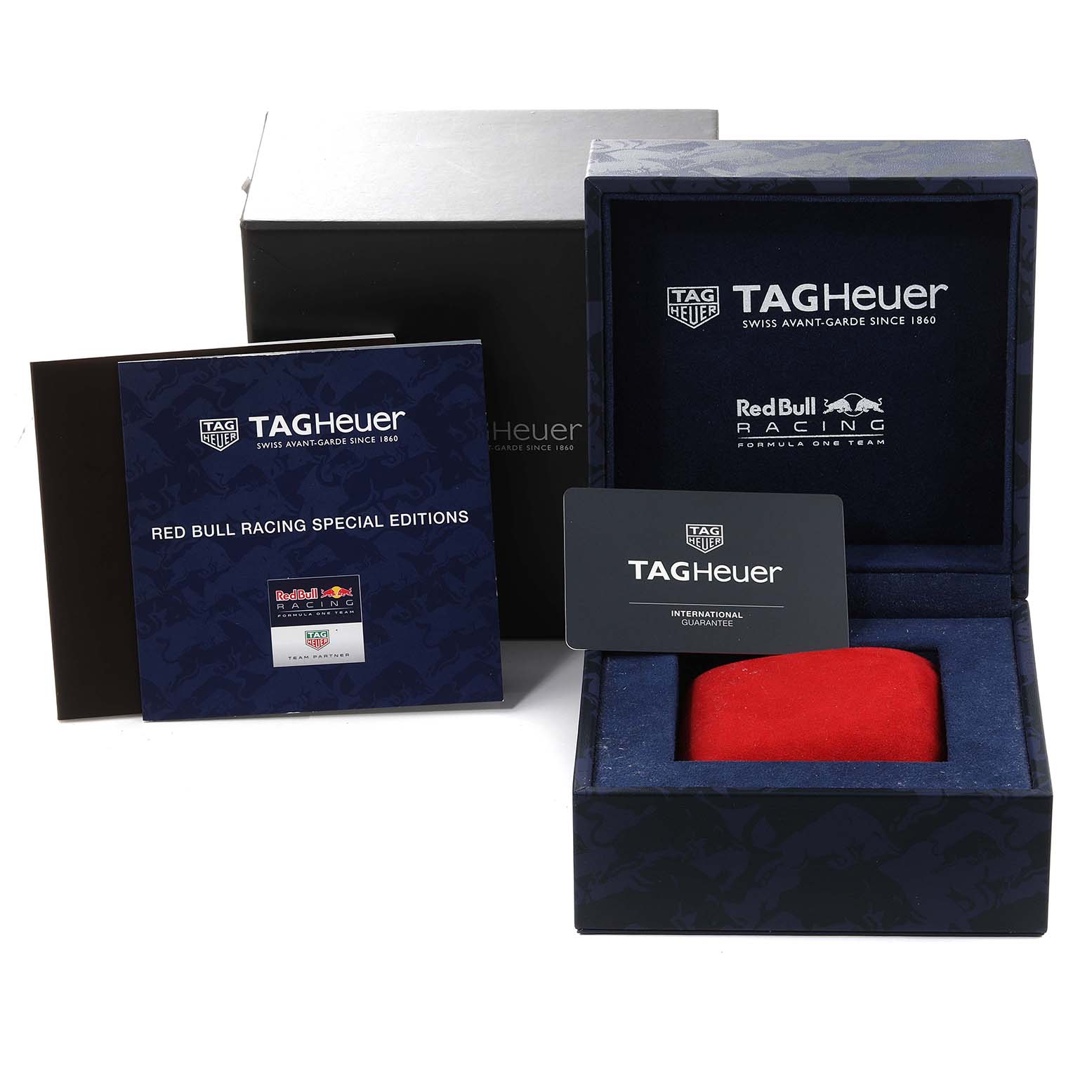 The image shows the packaging, a Red Bull Racing special edition booklet, and an international guarantee card for the Tag Heuer Carrera CAR2A1N.FT6100 Men's Stainless Steel Blue Dial CAR2A1N.FT6100 Men's Stainless Steel Blue Dial model.