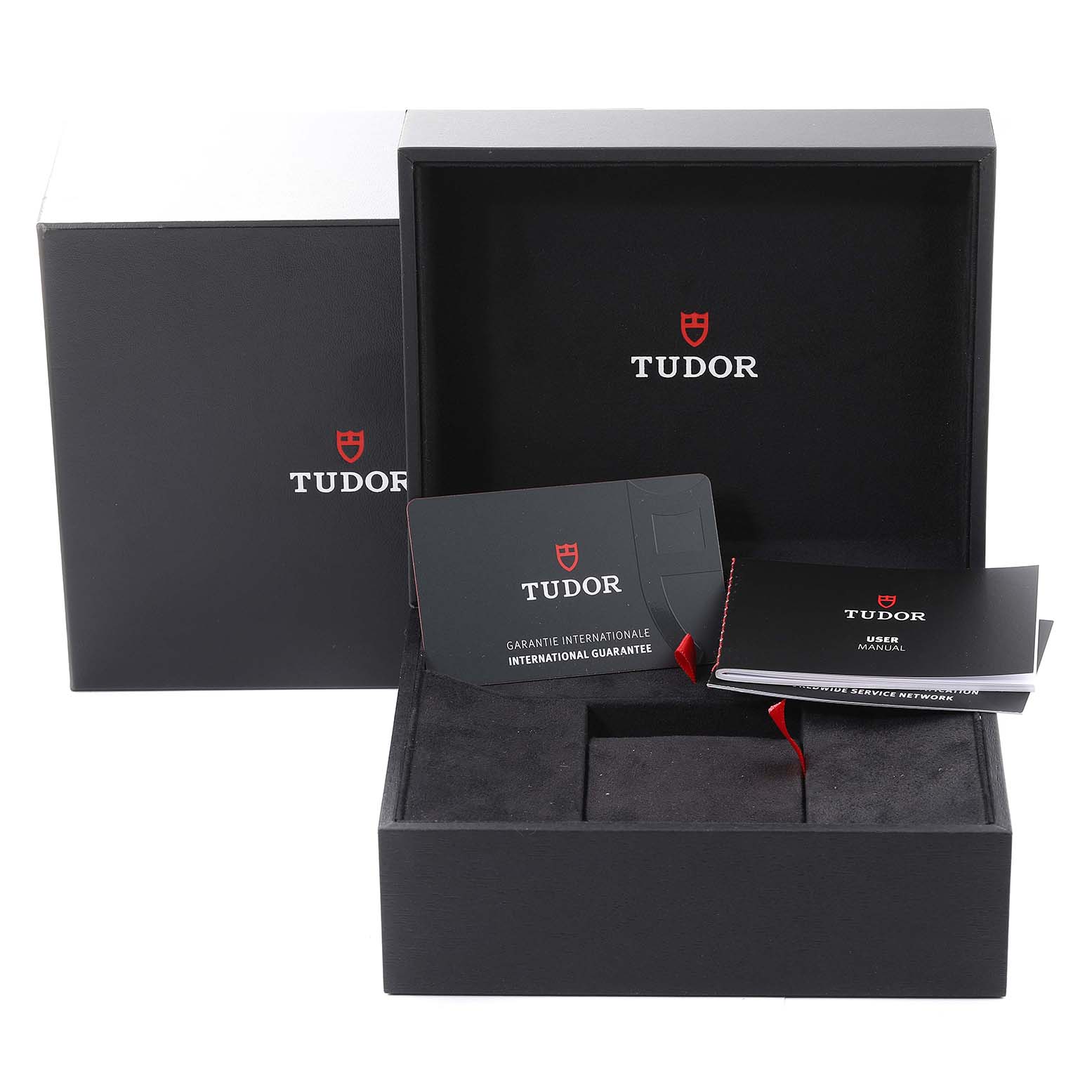 The image shows the packaging and accessories for the Tudor Heritage Black Bay 79360N Men's Stainless Steel Black Dial 79360N Men's Stainless Steel Black Dial watch, including the box, warranty card, and user manual.