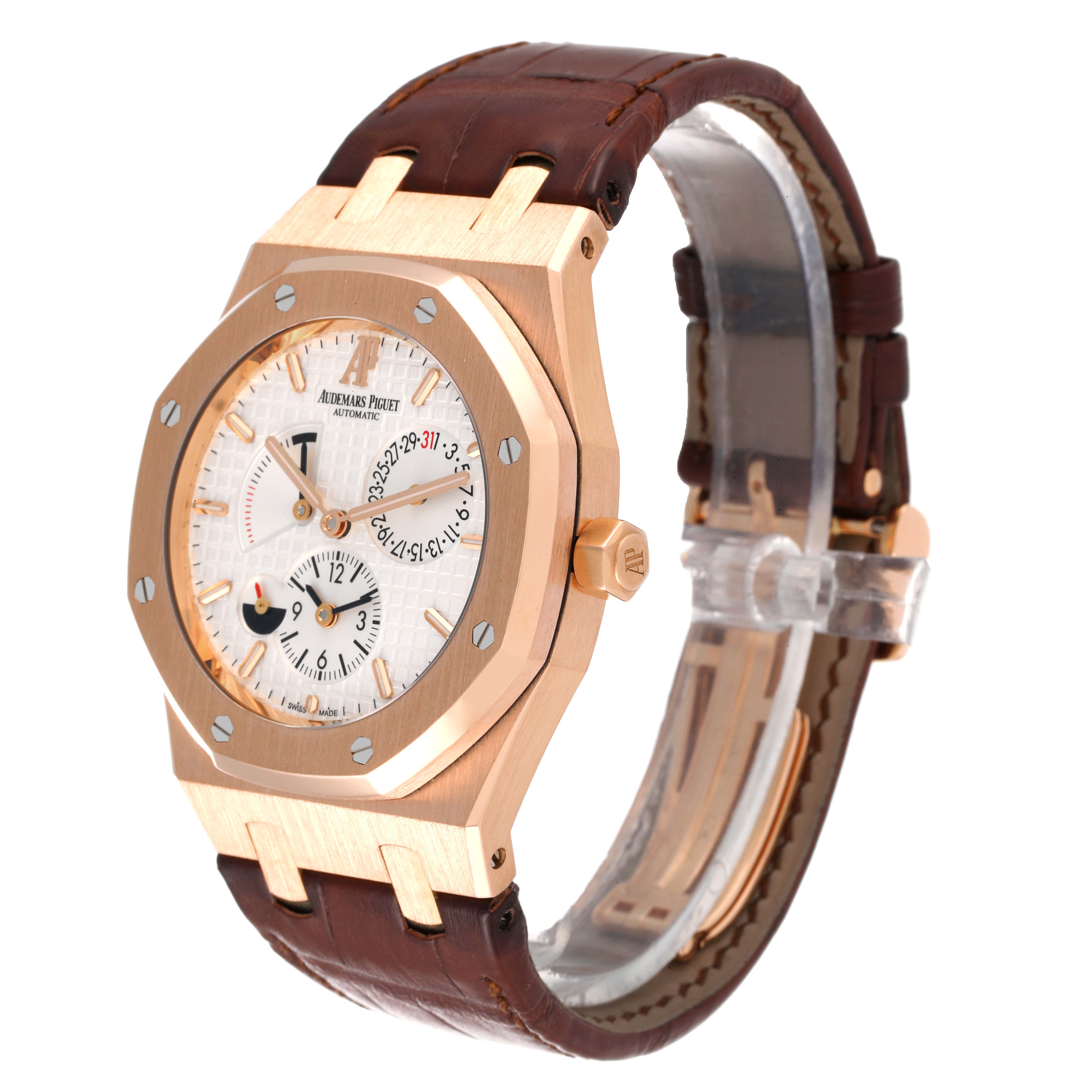The image shows a Royal Oak watch by Audemars Piguet from an angled side view, displaying the watch face, case, crown, and leather strap.