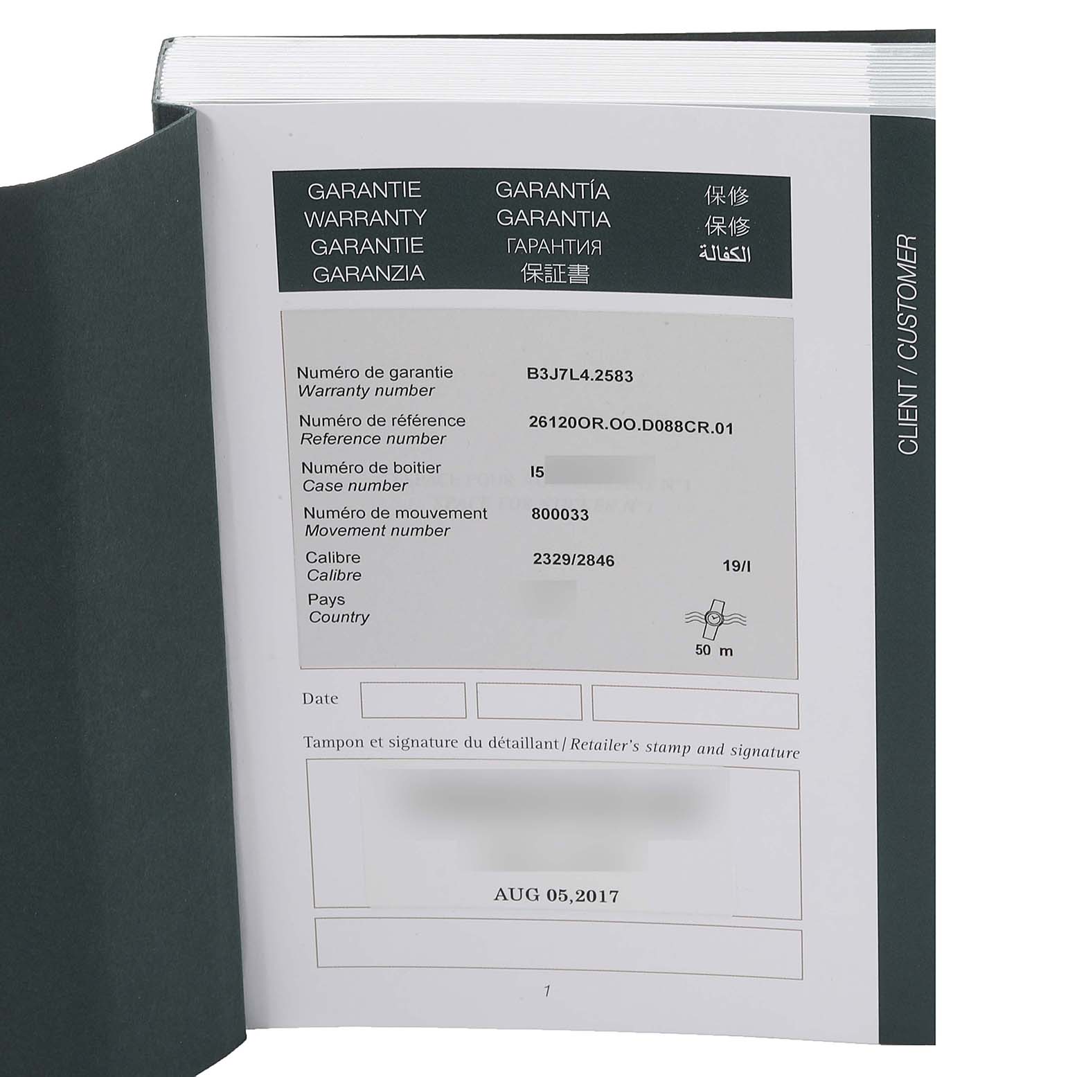 The image shows a warranty booklet for an Audemars Piguet Royal Oak 26120OR.00.D088CR.01 Men's Rose Gold Silver Dial 26120OR.00.D088CR.01 Men's Rose Gold Silver Dial model, displaying details like warranty number, reference number, and date of purchase.