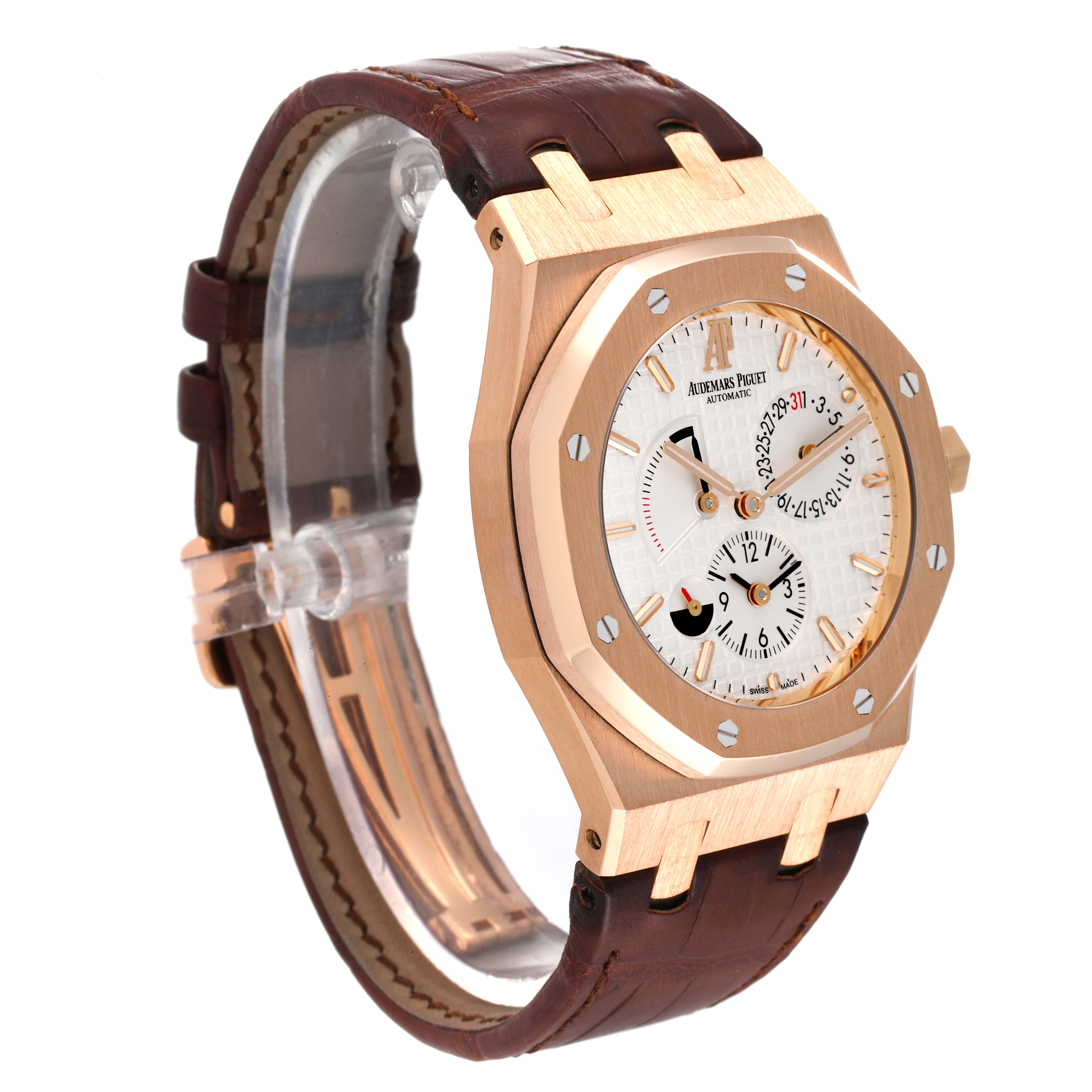 The image shows a side angle of the Royal Oak model by Audemars Piguet, displaying the watch face and brown leather strap.