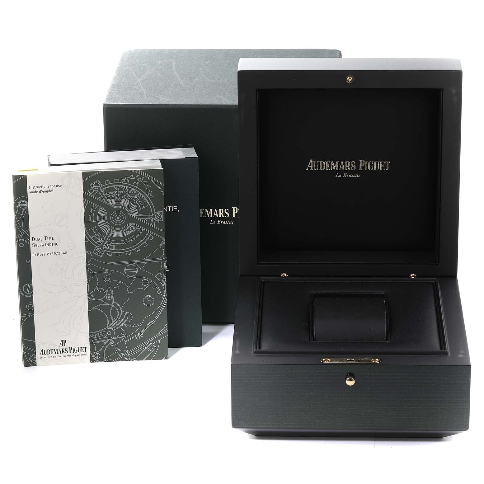 The image shows a Royal Oak model Audemars Piguet watch box, accompanying booklets, and outer packaging.