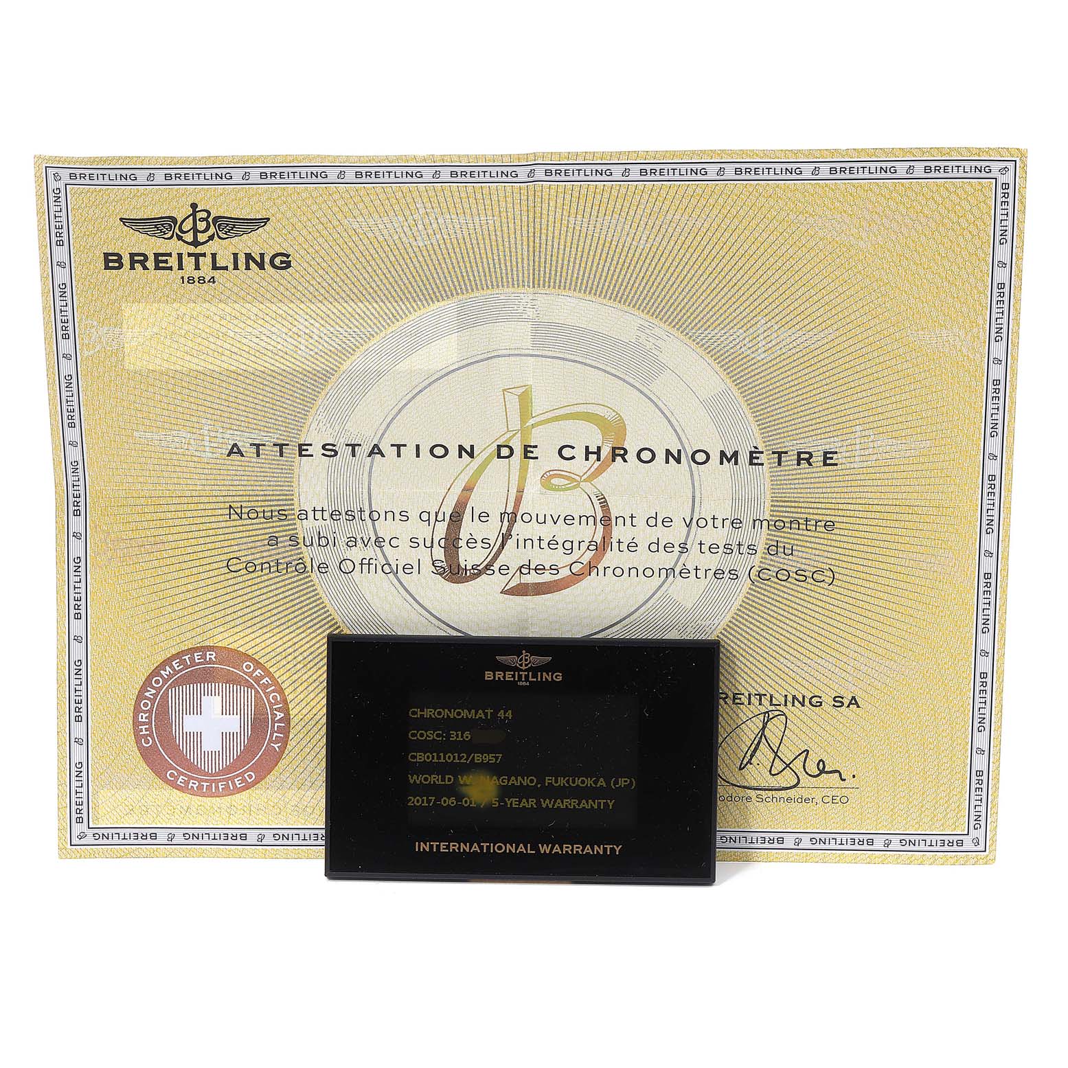 The image shows a certificate and an international warranty card for the Breitling Chronomat CB0110 Men's Rose Gold Black Dial CB0110 Men's Rose Gold Black Dial watch model.