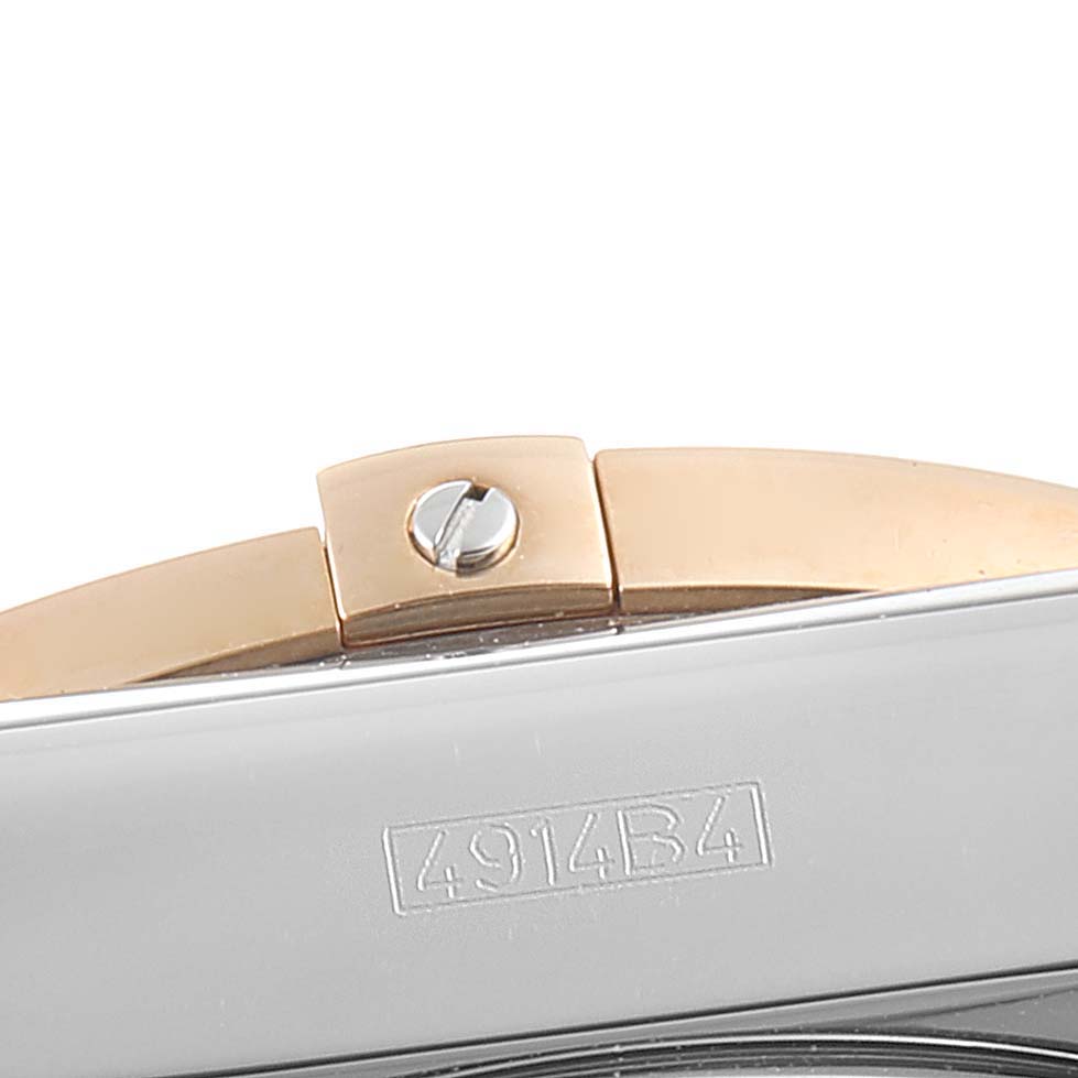 The image shows a close-up of the clasp and serial number of a Breitling Chronomat CB0110 Men's Rose Gold Black Dial CB0110 Men's Rose Gold Black Dial watch.