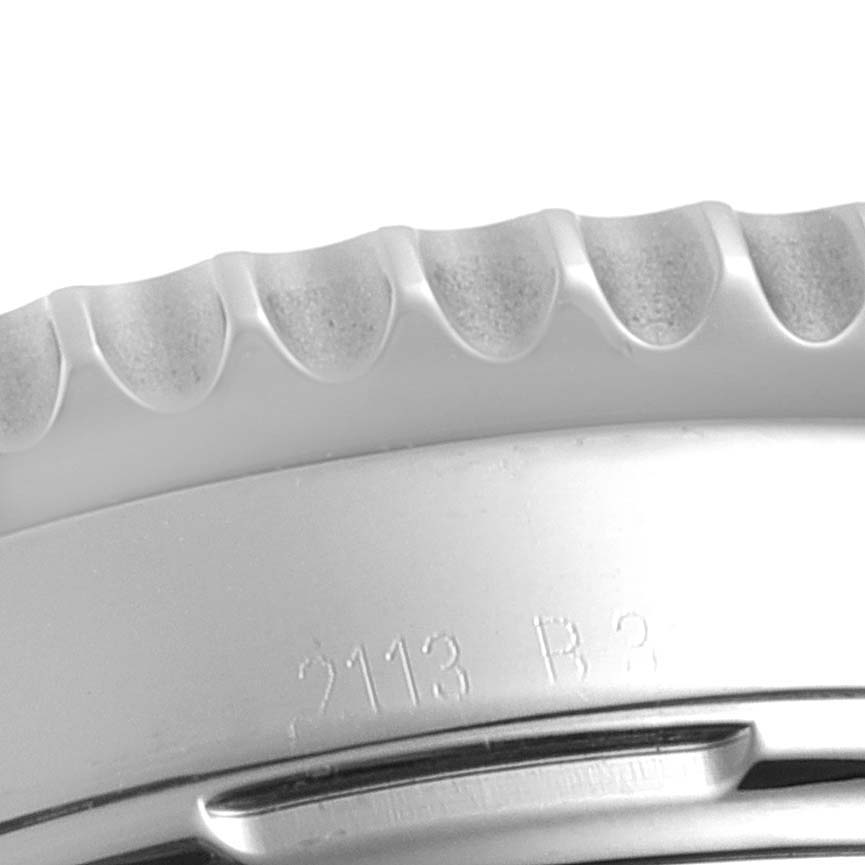 The image shows a close-up of the bezel and case of a Breitling Navitimer AB0120 Men
s Stainless Steel Black Dial AB0120 Men
s Stainless Steel Black Dial watch.