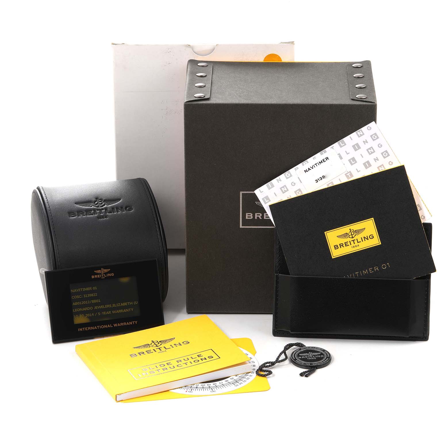 The image shows a Breitling Navitimer AB0120 Men
s Stainless Steel Black Dial AB0120 Men
s Stainless Steel Black Dial watch box, warranty card, manuals, and accessories.