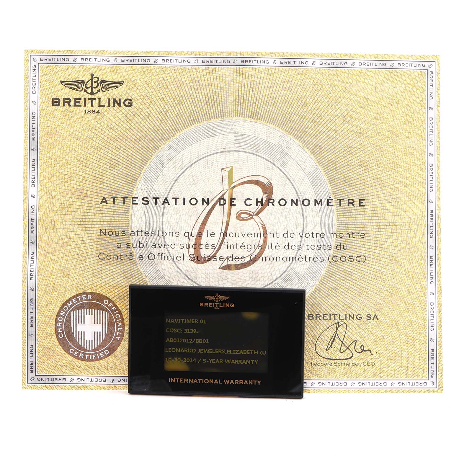 The image shows the Breitling Navitimer AB0120 Men
s Stainless Steel Black Dial AB0120 Men
s Stainless Steel Black Dial model
s chronometer certificate and international warranty card from a front-facing angle.