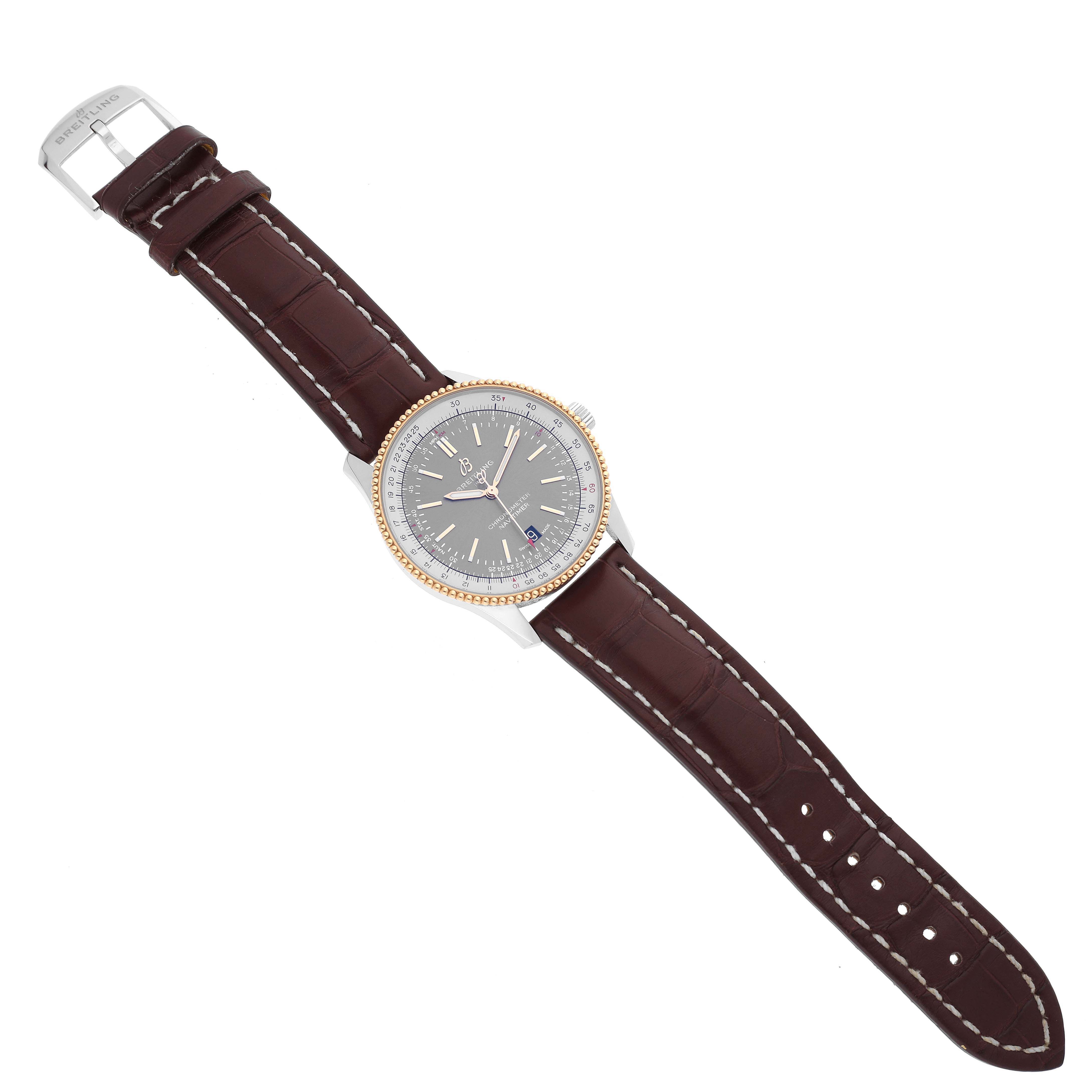 The Breitling Navitimer U17326 Men's Steel and Gold (two tone) Grey Dial U17326 Men's Steel and Gold (two tone) Grey Dial watch is shown from an overhead angle, displaying the dial, bezel, case, and brown leather strap.