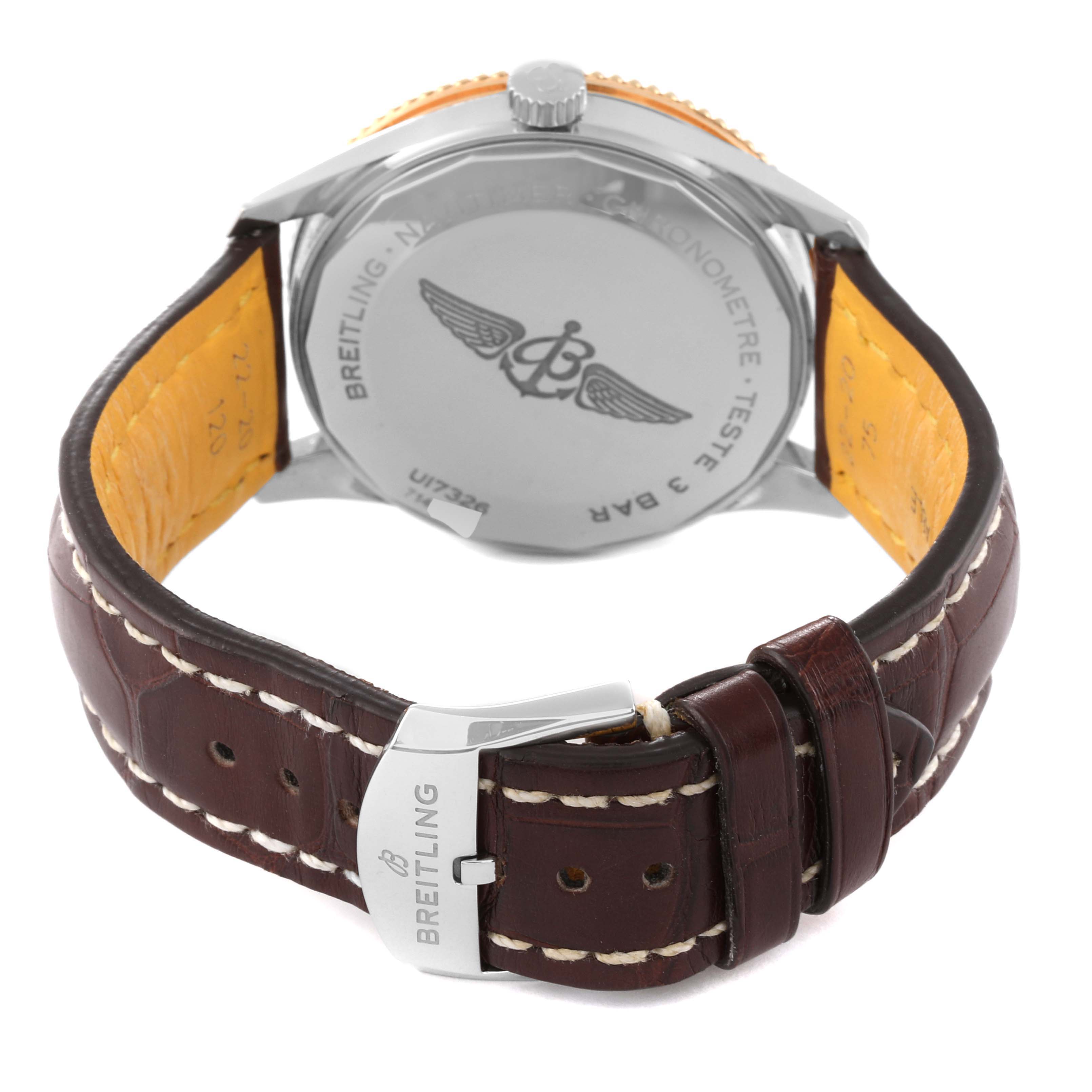 The image shows the back and buckle of a Breitling Navitimer U17326 Men's Steel and Gold (two tone) Grey Dial U17326 Men's Steel and Gold (two tone) Grey Dial watch, highlighting the case back, crown, and leather strap.
