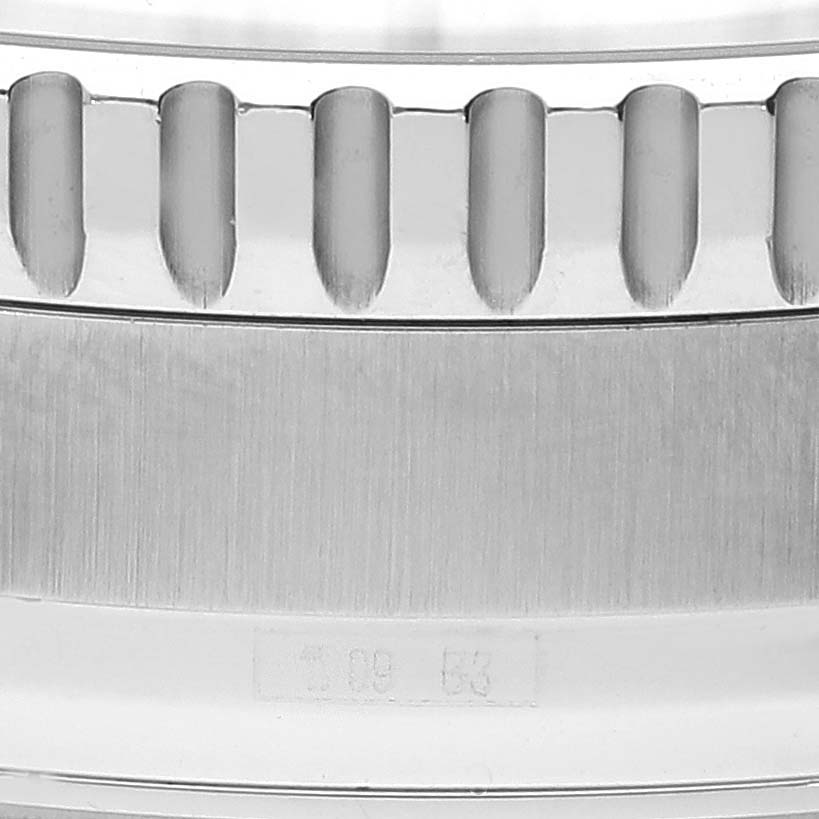 This image shows a close-up of the bezel and part of the case of a Breitling Navitimer A26322 Men's Stainless Steel Black Dial A26322 Men's Stainless Steel Black Dial watch.