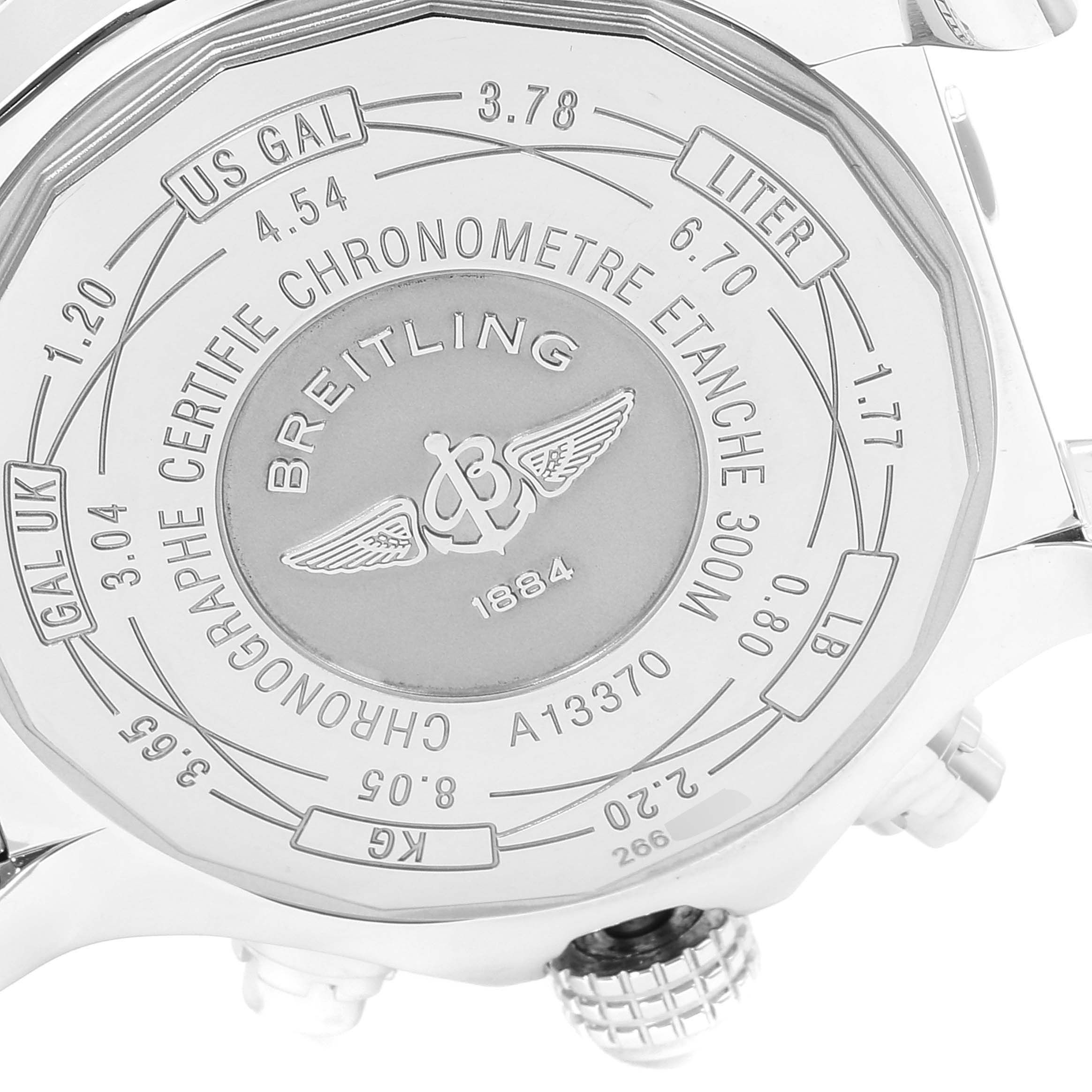 The image shows the back of a Breitling Avenger A13370 Men's Stainless Steel White Dial A13370 Men's Stainless Steel White Dial model watch with engravings and conversion charts.