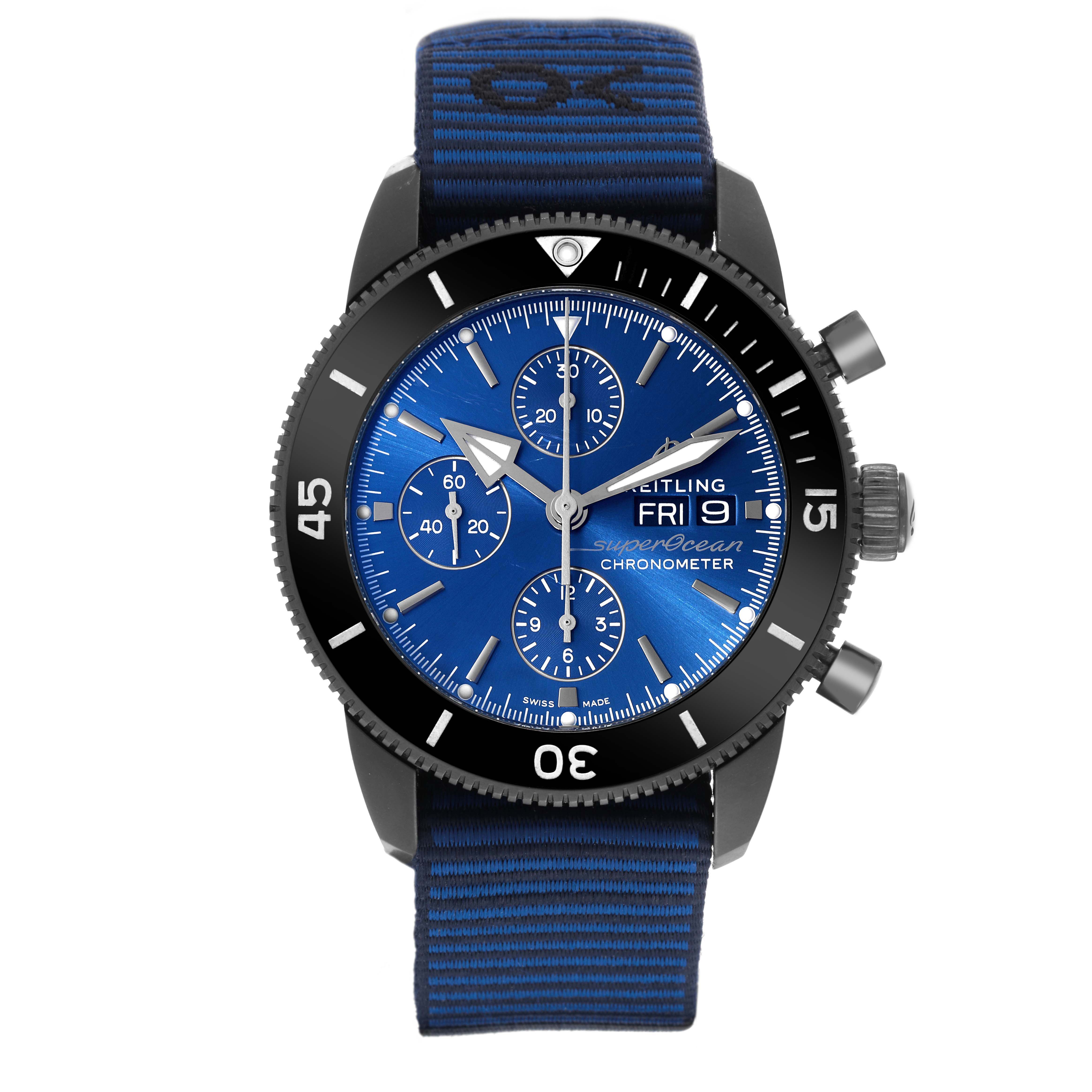The image shows a front view of a Breitling Superocean M13313 Men's Stainless Steel Blue Dial M13313 Men's Stainless Steel Blue Dial watch, featuring a blue dial, chronograph subdials, and a fabric strap.