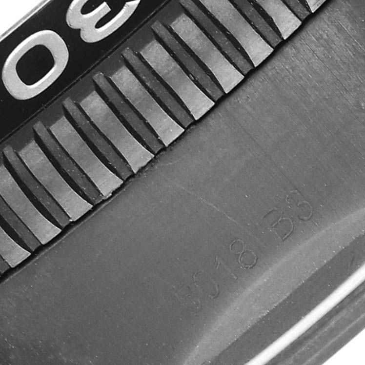 The image shows a close-up of the bezel and part of the case back of the Breitling Superocean M13313 Men's Stainless Steel Blue Dial M13313 Men's Stainless Steel Blue Dial watch.