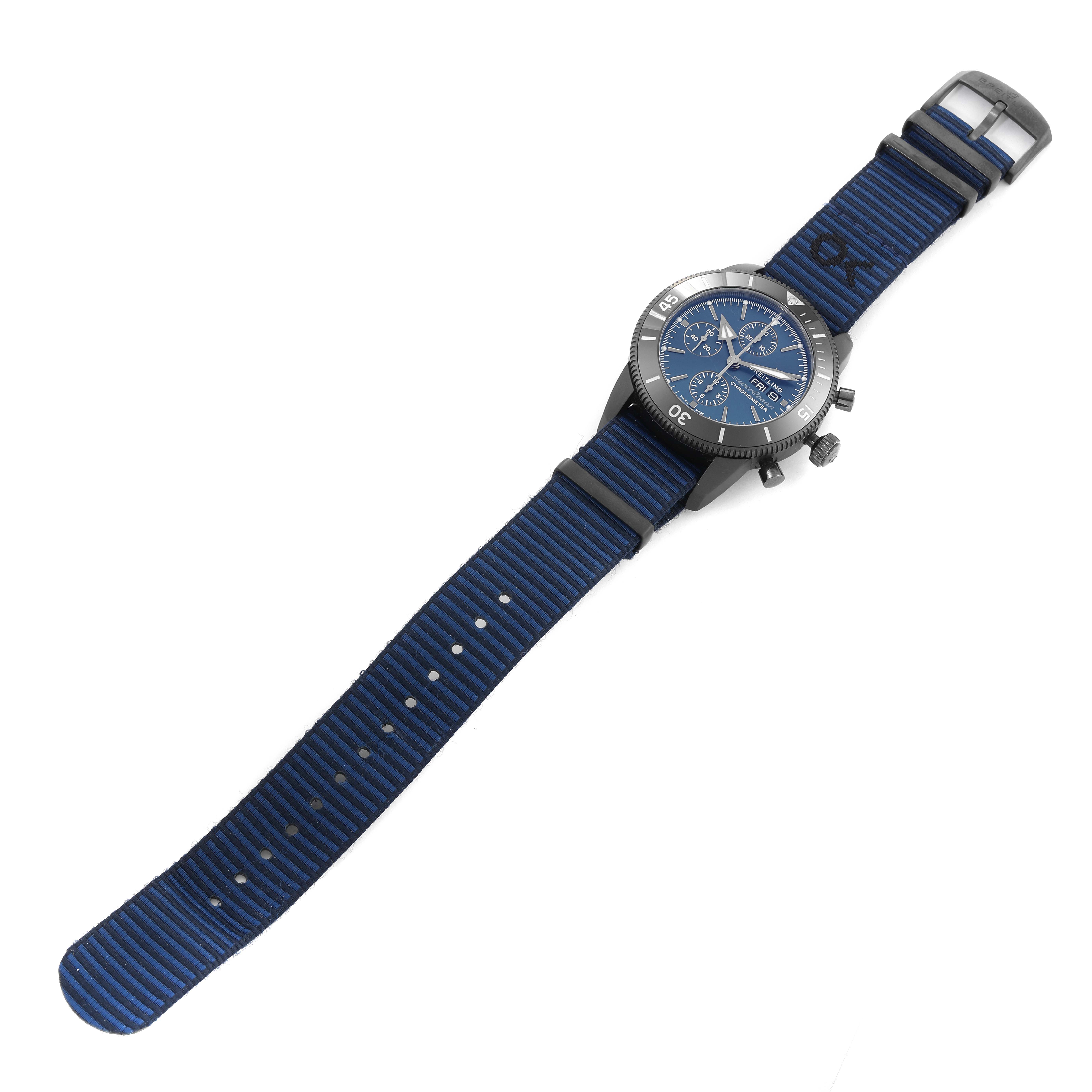 The image shows a full view of the Breitling Superocean M13313 Men's Stainless Steel Blue Dial M13313 Men's Stainless Steel Blue Dial watch featuring a blue nylon strap and a round dial with chronograph functions.