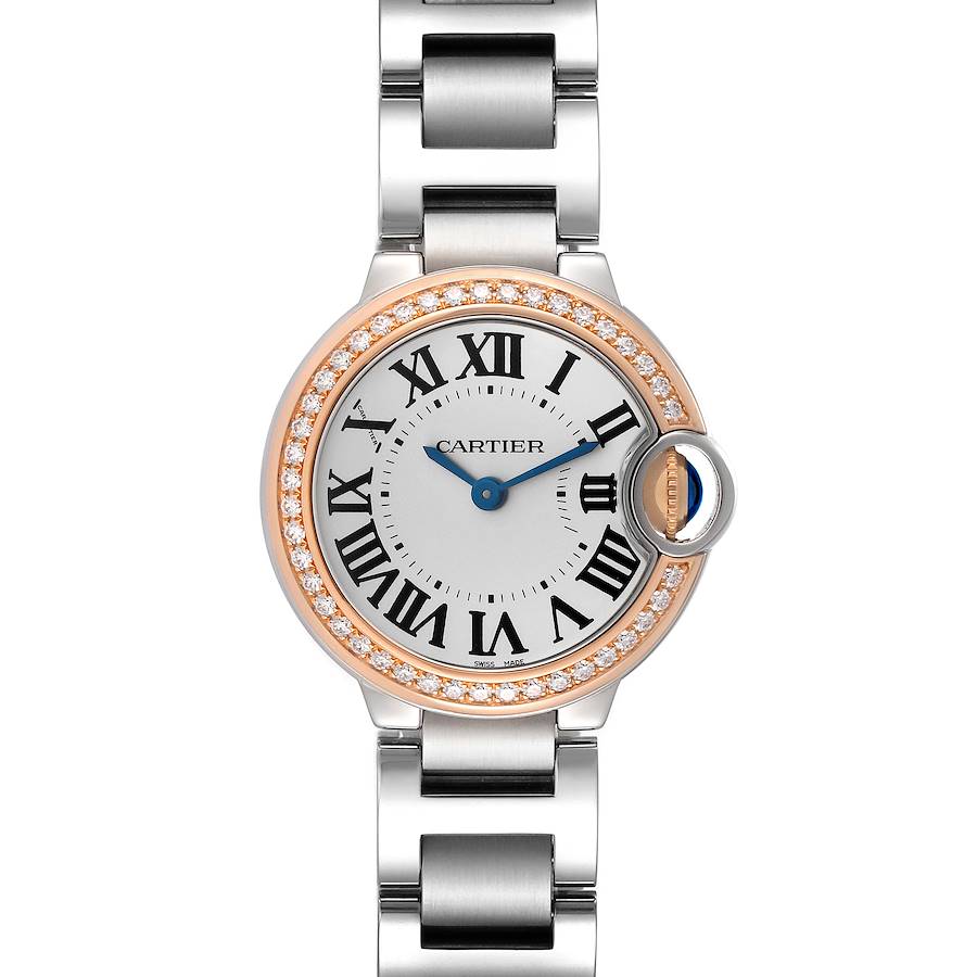 The Cartier Ballon Bleu watch is shown from a top-down angle, highlighting its face, bezel with diamonds, and bracelet links.