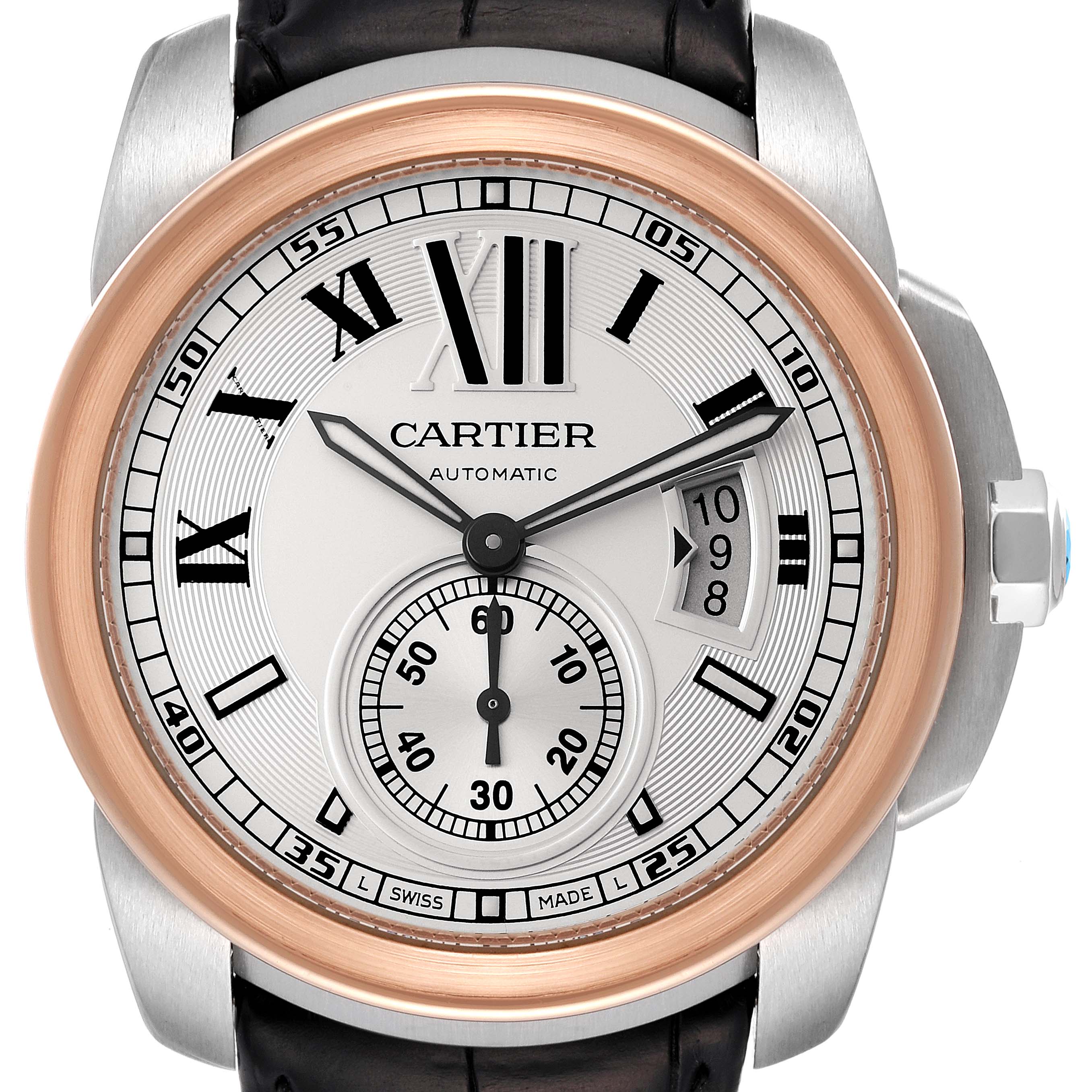 The image shows a front view of the Calibre de Cartier watch by Cartier, featuring its dial, hands, and bezel.