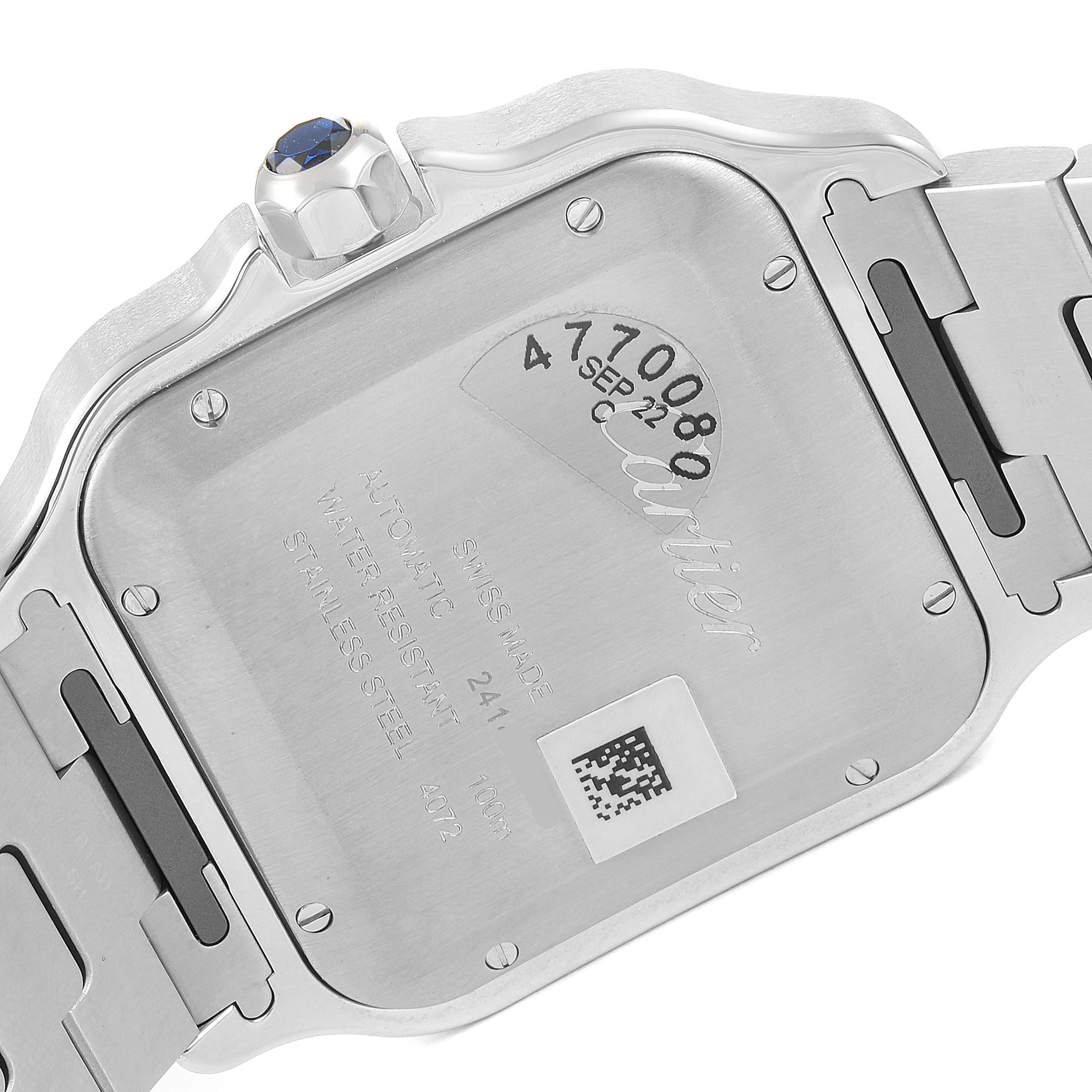 The image shows the back case and part of the bracelet of a Santos model by Cartier, viewed from a rear angle.