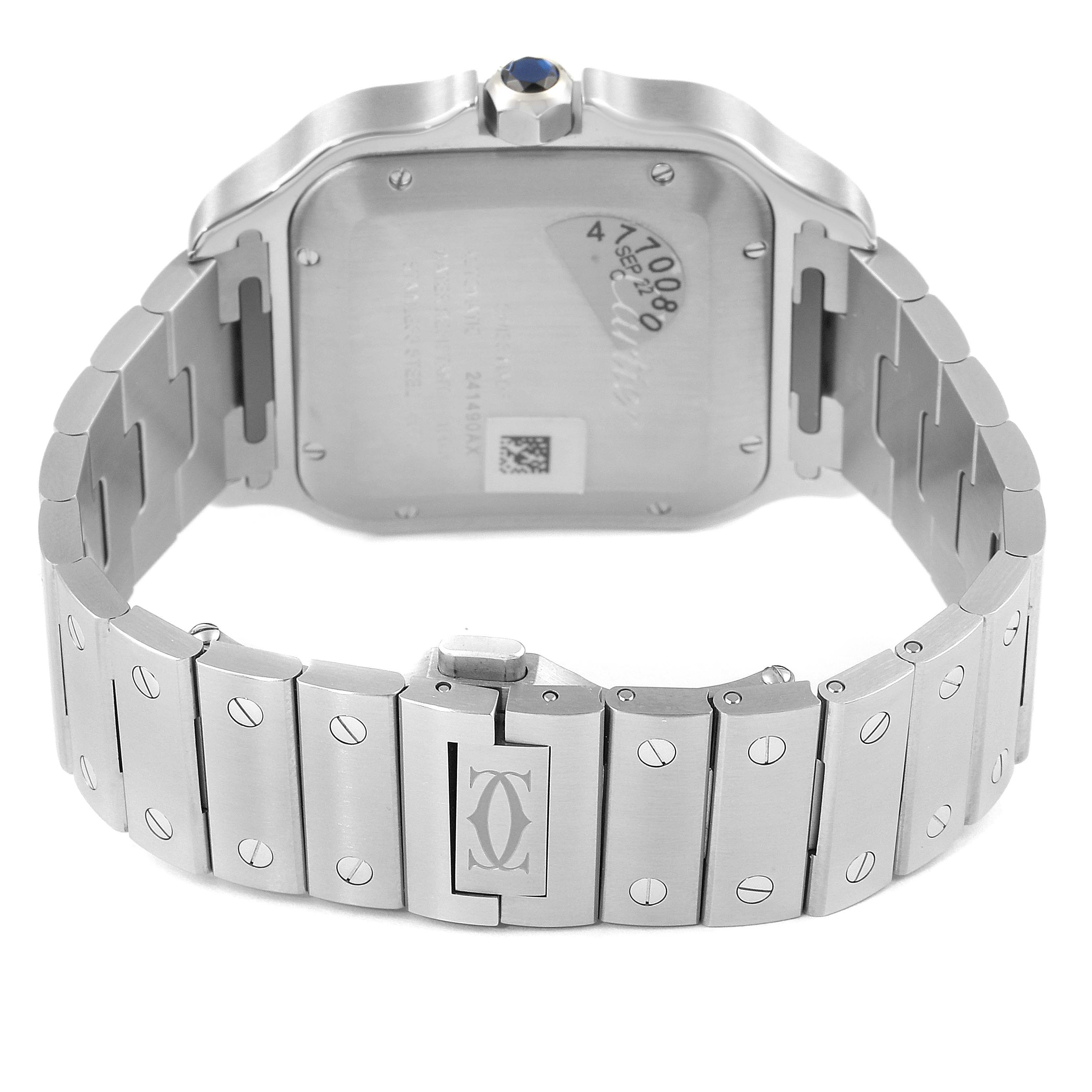 The image shows the back case and bracelet of a Cartier Santos WSSA0018 Men's Stainless Steel Silver Dial WSSA0018 Men's Stainless Steel Silver Dial watch, highlighting the lug screws and logo-engraved clasp.