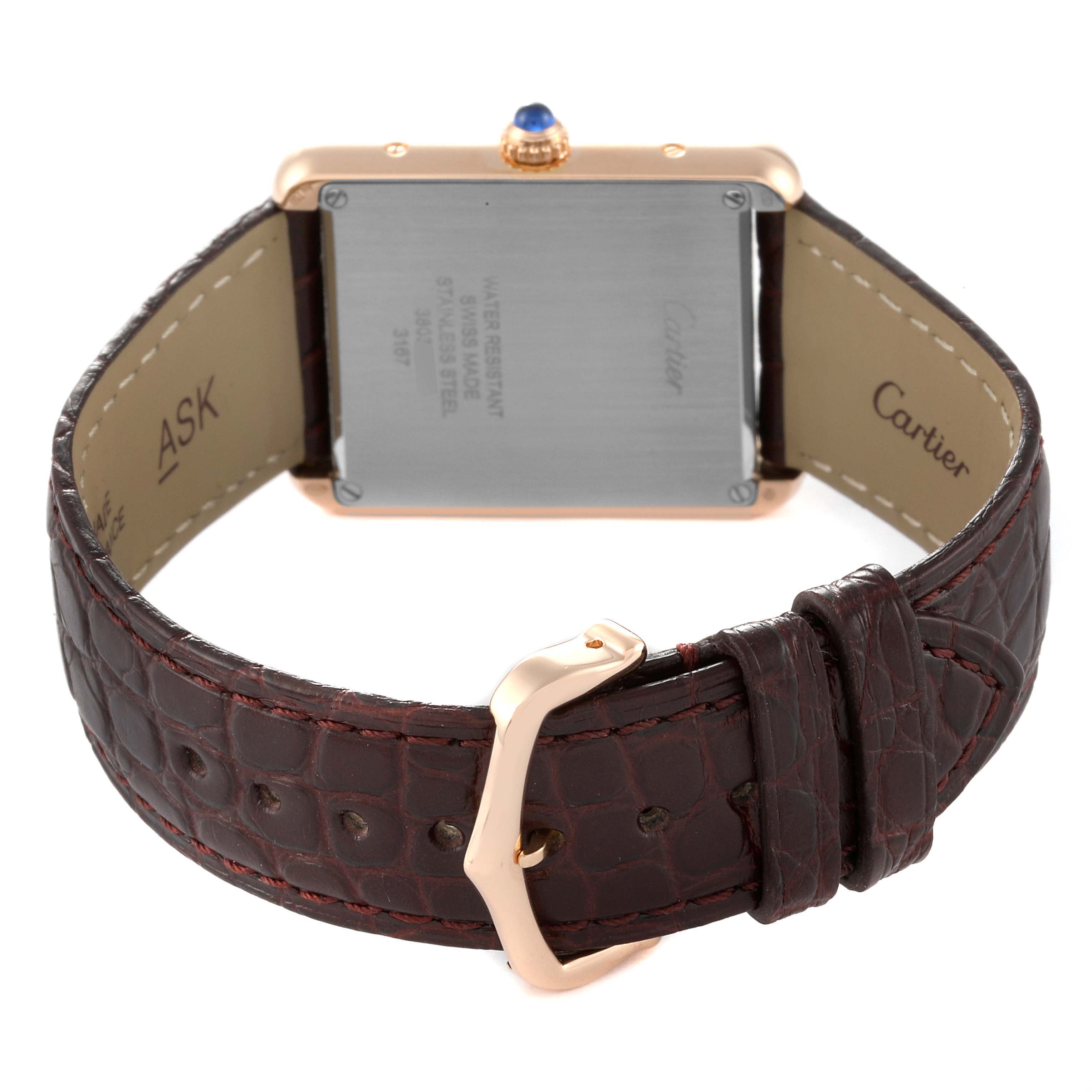 The image shows the back view of a Cartier Tank Solo W5200025 Men
s Steel and Gold (two tone) Silver Dial W5200025 Men
s Steel and Gold (two tone) Silver Dial watch, highlighting the case back, crown, and leather strap with buckle.