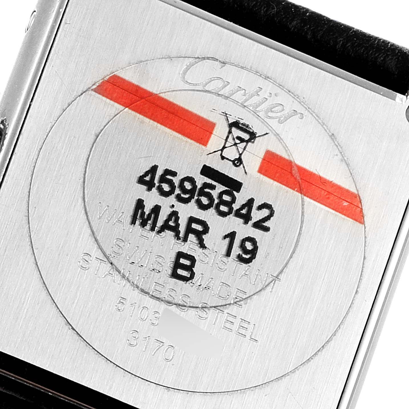 This image shows the back case of a Cartier Tank Solo W1018255 Women
s Stainless Steel Silver Dial W1018255 Women
s Stainless Steel Silver Dial watch displaying its serial number and manufacturing details.