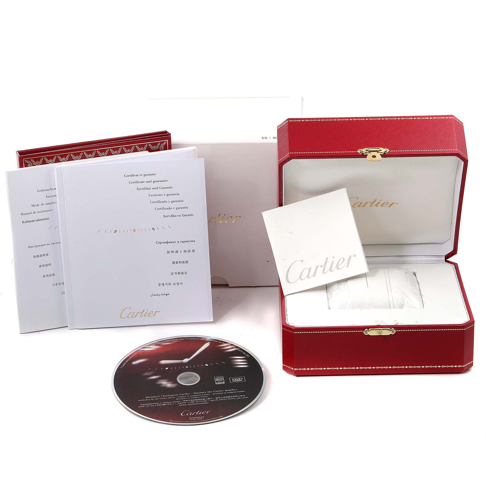 The image shows the accessories of a Cartier Delices W8100003 Women's Rose Gold Silver Dial W8100003 Women's Rose Gold Silver Dial watch, including a red box, booklets, and a CD.