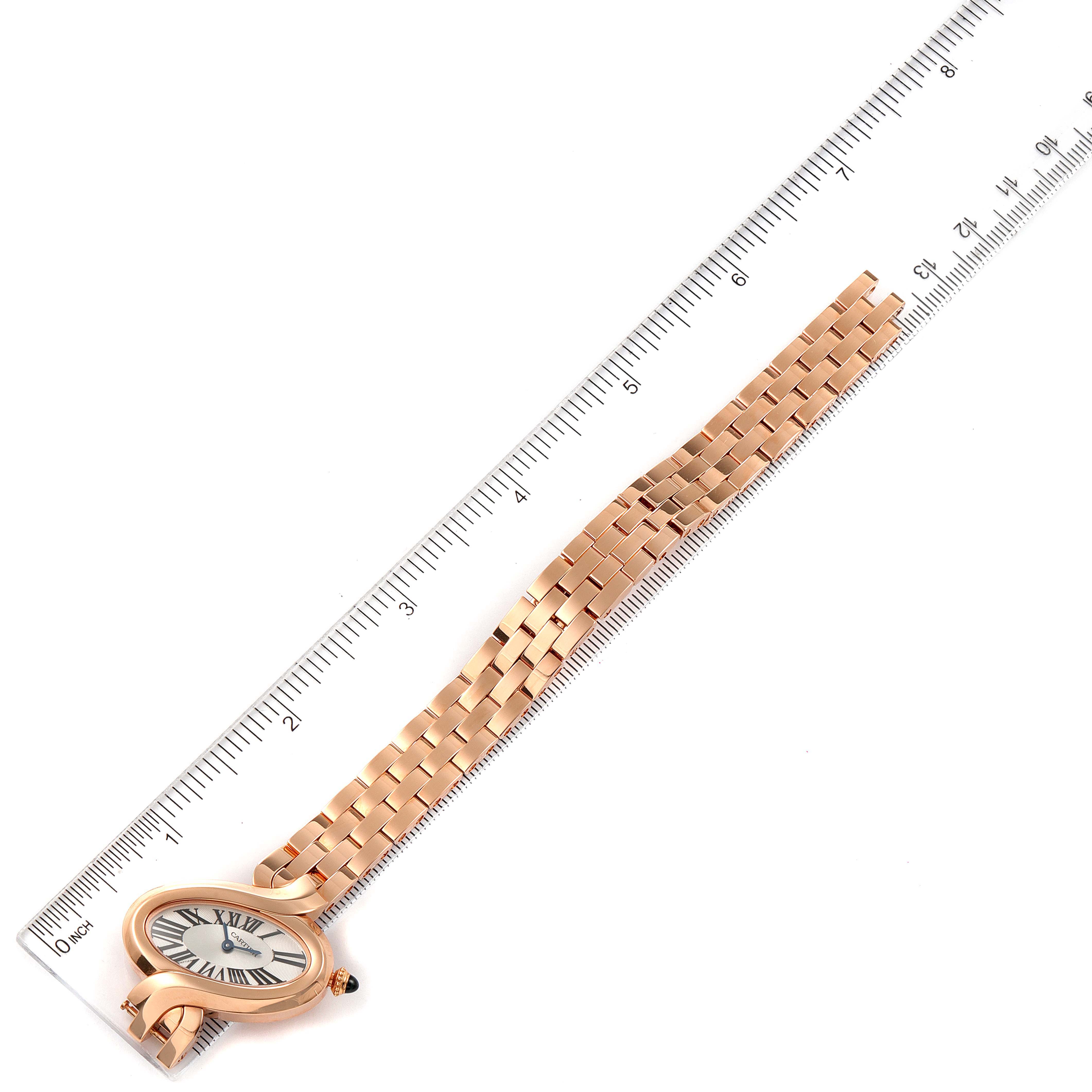 The image shows a Cartier Delices W8100003 Women's Rose Gold Silver Dial W8100003 Women's Rose Gold Silver Dial watch laid flat against a ruler, focusing on its face and metal strap.