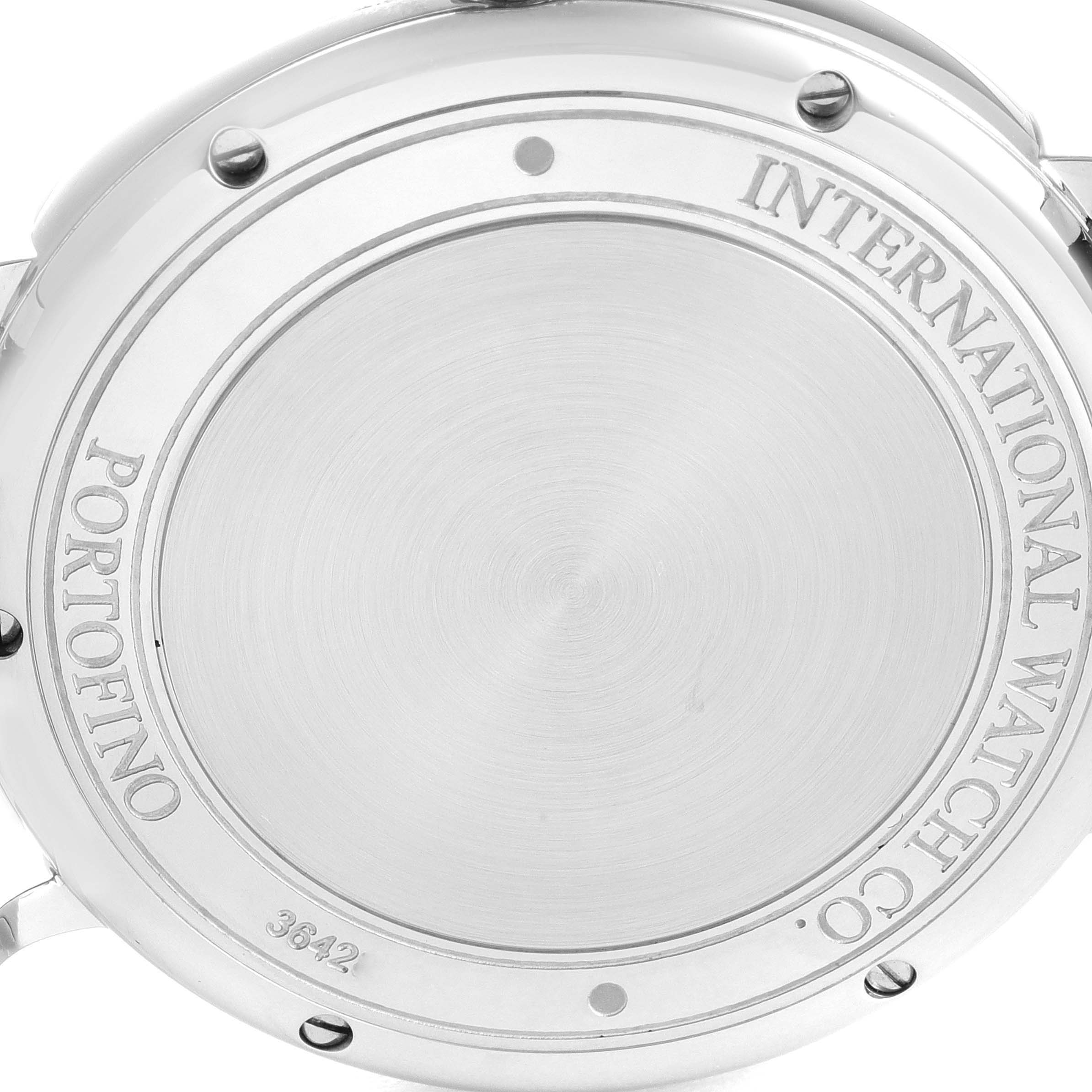 The image shows the back case of a Portofino model watch by IWC, displaying engravings and screws.