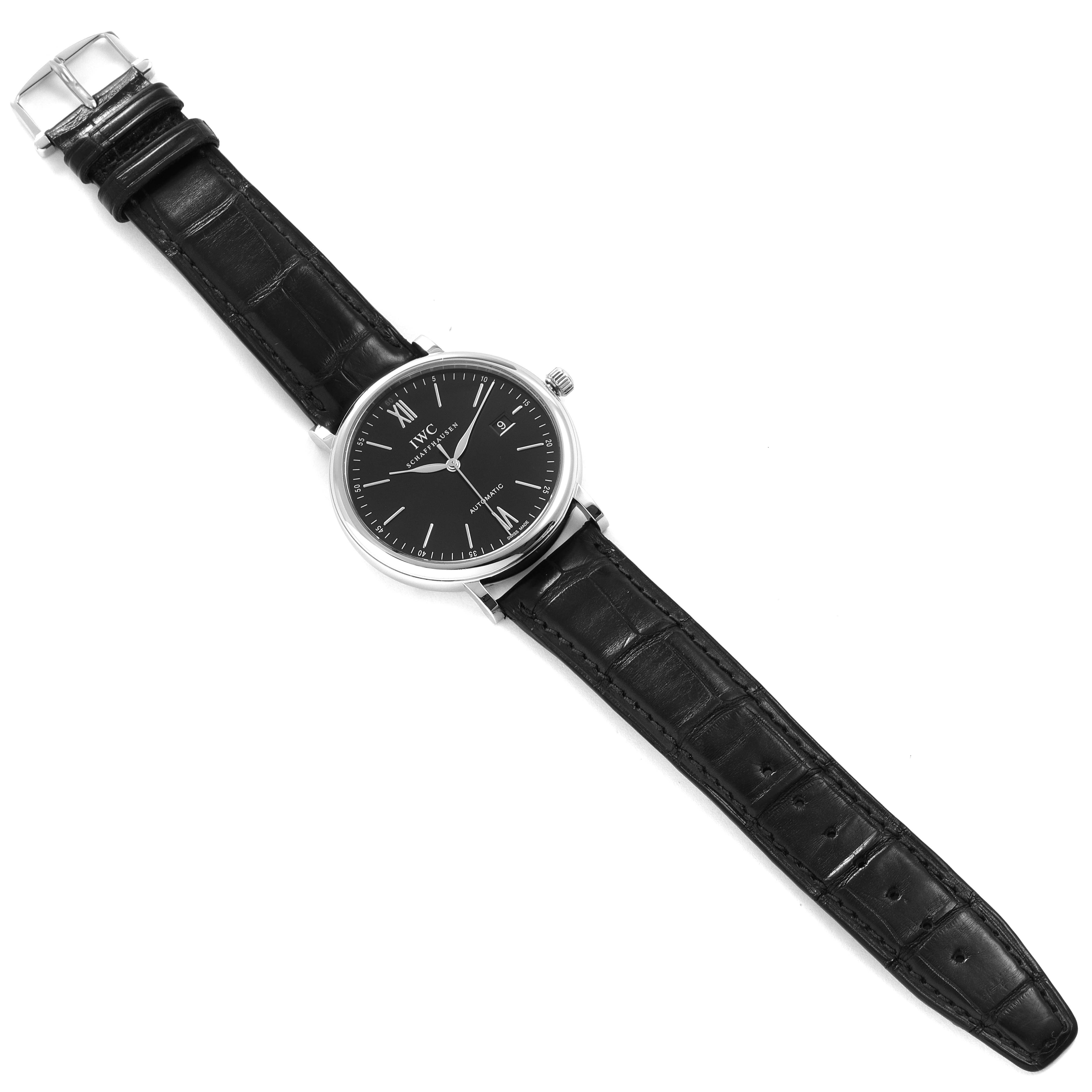 This image shows the IWC Portofino IW356502 Men's Stainless Steel Black Dial IW356502 Men's Stainless Steel Black Dial watch from a top-down angle, displaying the face, case, and leather strap.