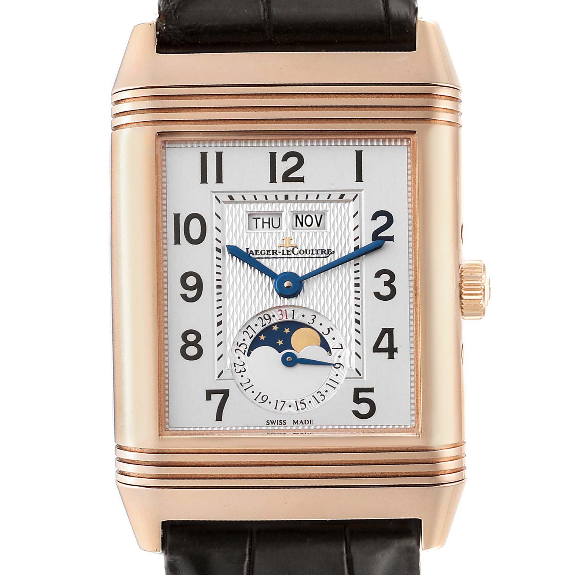 The image shows a frontal view of the Jaeger-LeCoultre Reverso watch, highlighting its dial, hands, date, and moon phase features.