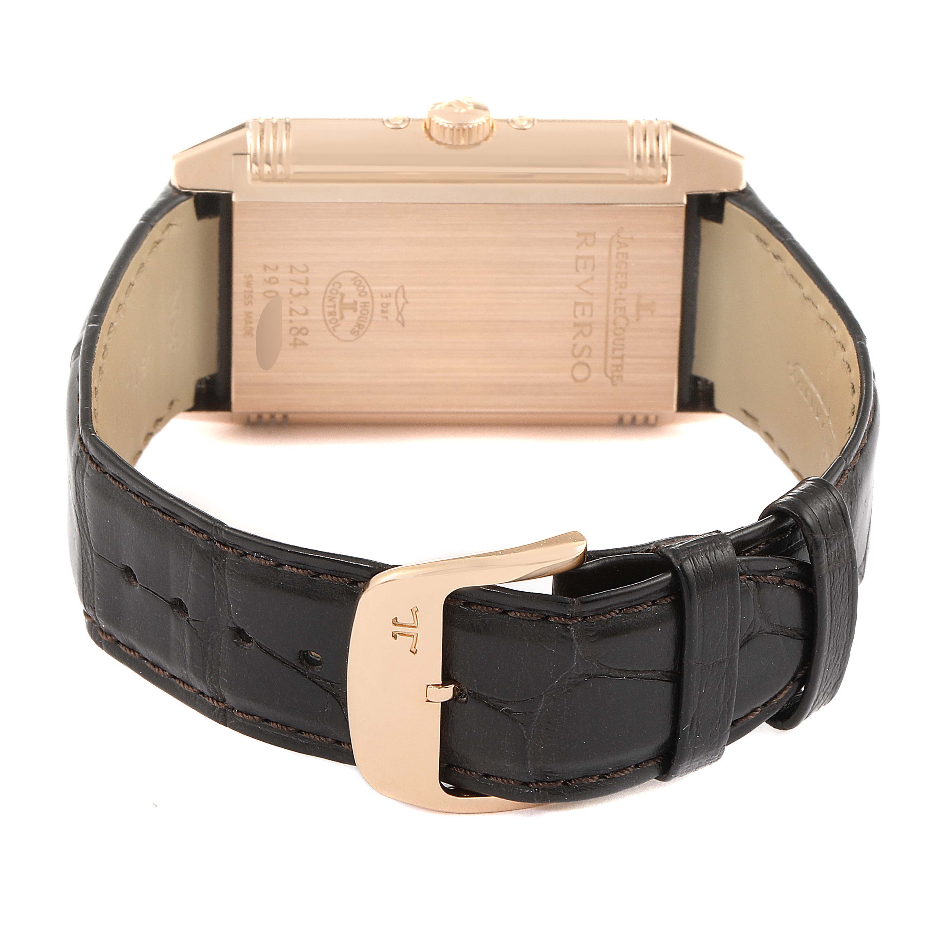 The image shows a Jaeger-LeCoultre Reverso watch from the back, highlighting the strap and buckle.