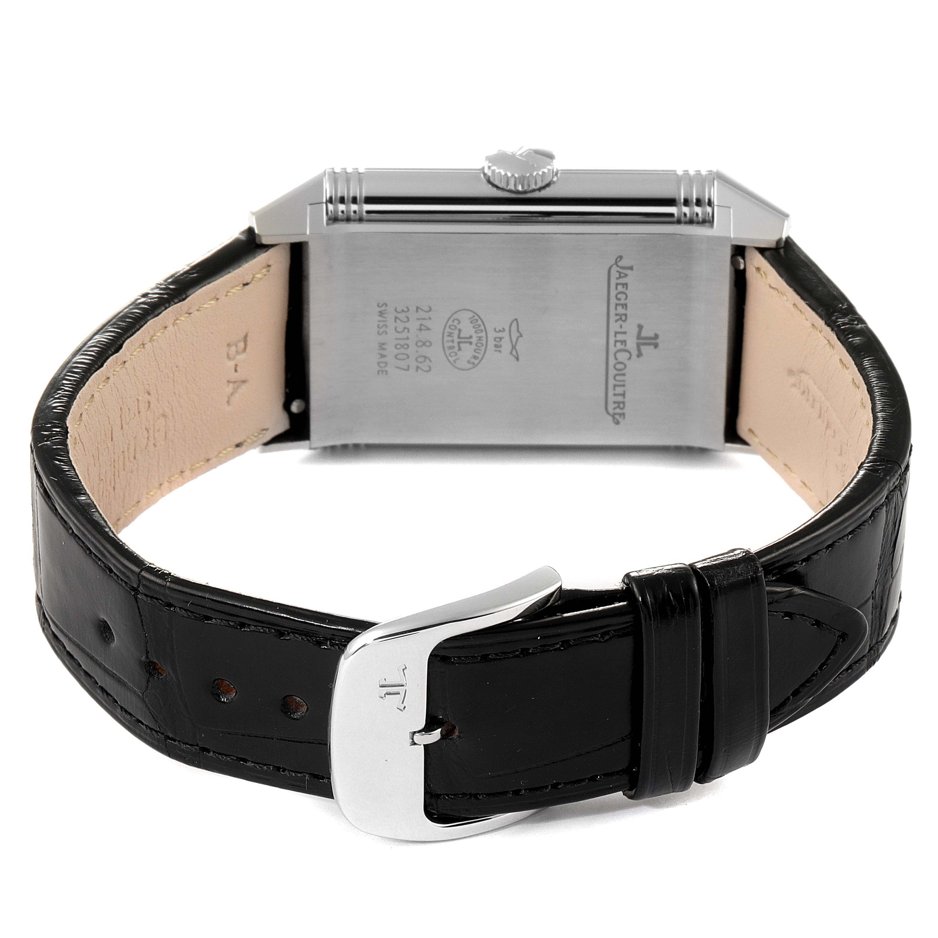 The image shows the back of the Jaeger LeCoultre Reverso Q3858520 Men's Stainless Steel Silver Dial Q3858520 Men's Stainless Steel Silver Dial watch and its black leather strap with a silver buckle.