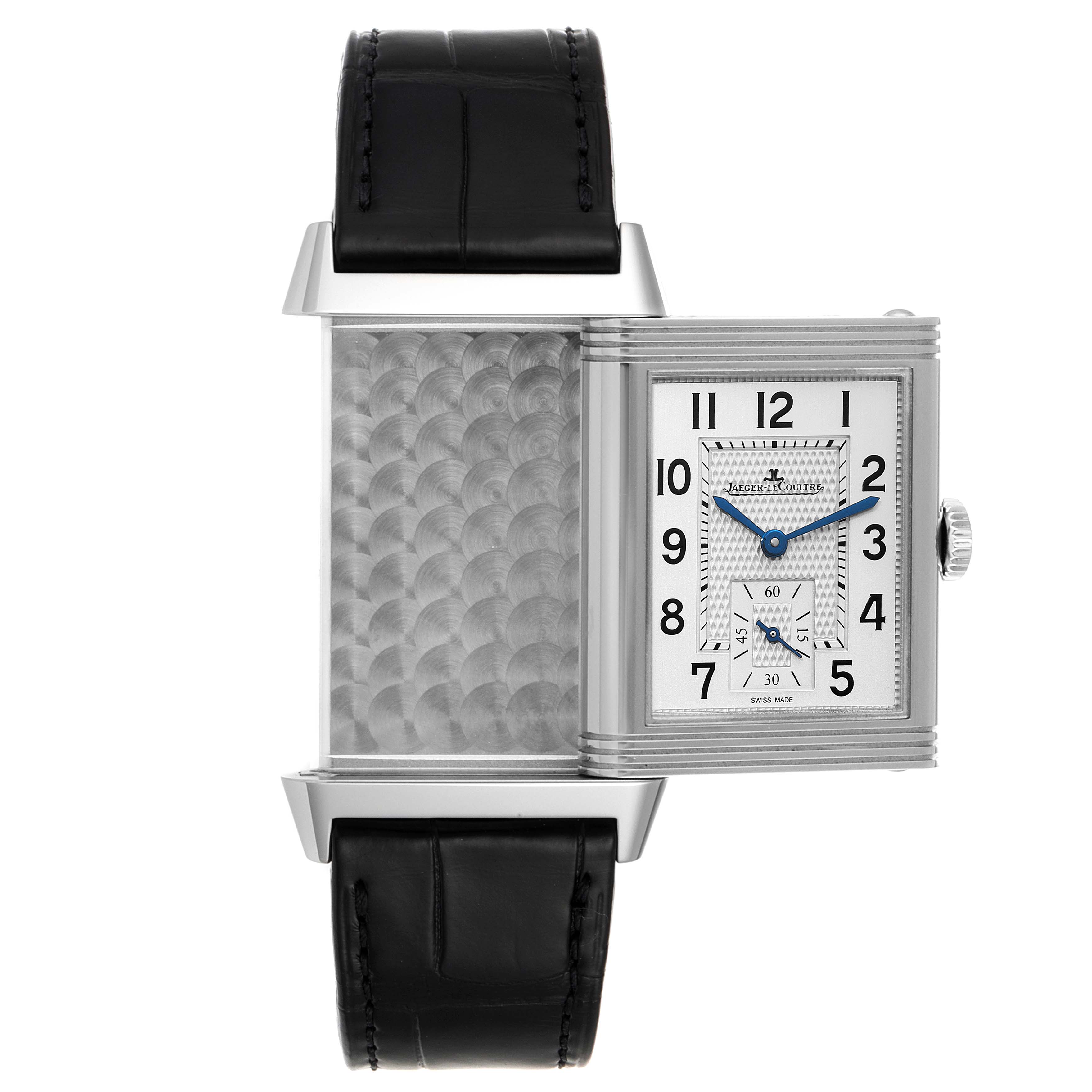 The image shows the Jaeger LeCoultre Reverso Q3858520 Men's Stainless Steel Silver Dial Q3858520 Men's Stainless Steel Silver Dial watch with its case partially opened, revealing its inner detailing and dial.