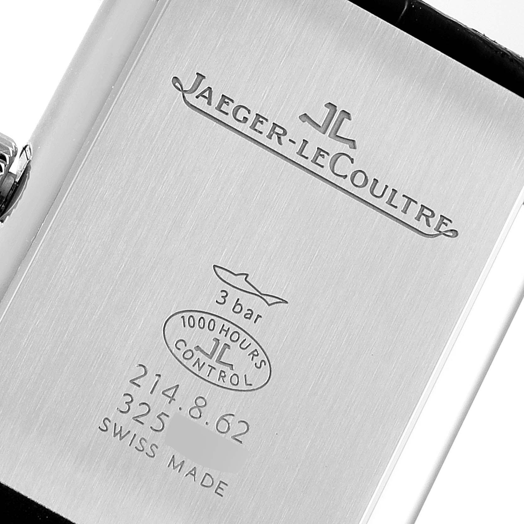 The image shows the back of the Jaeger-LeCoultre Reverso watch, displaying its logo, model information, and certification details.