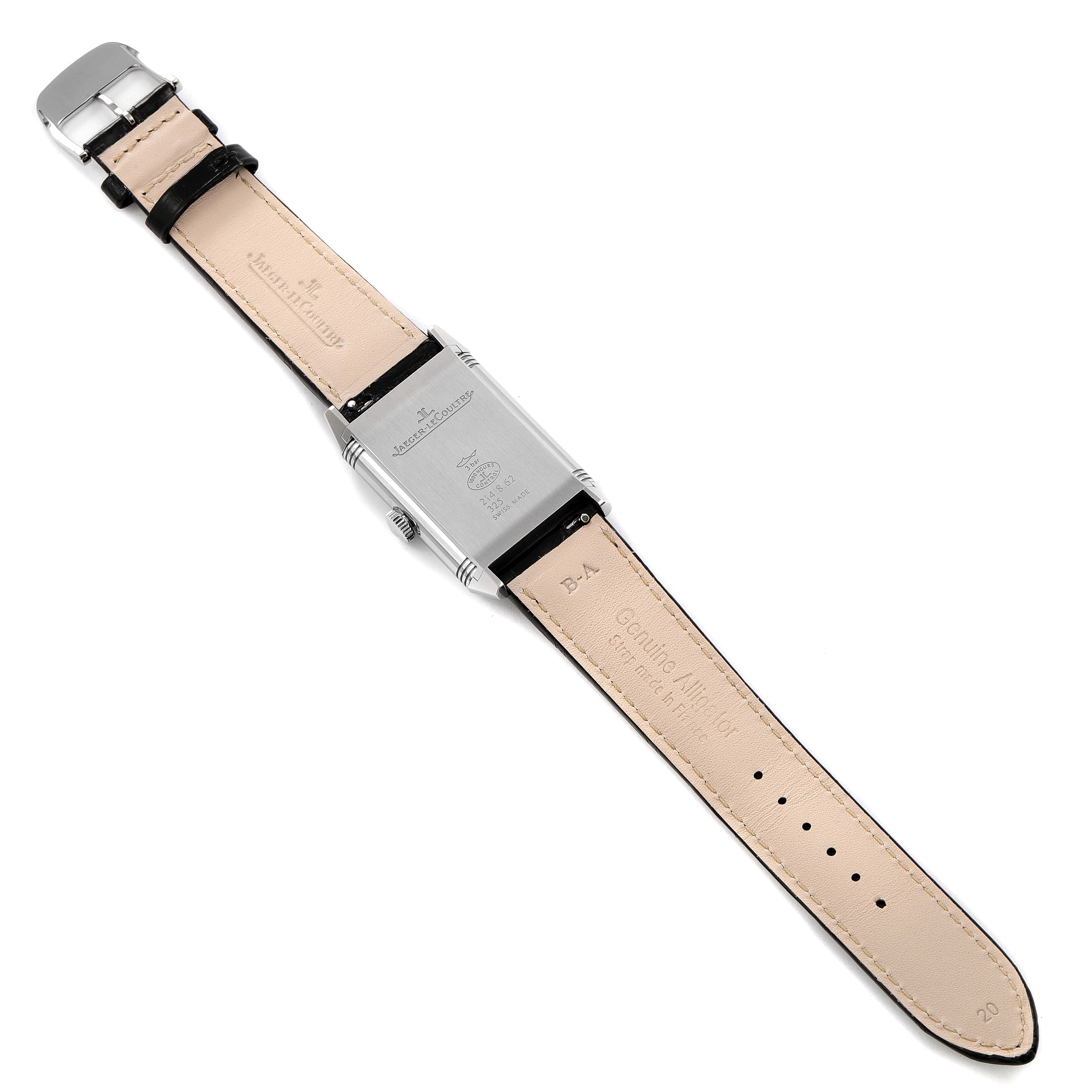 The image shows the back of a Jaeger-LeCoultre Reverso watch with its leather strap fully extended.