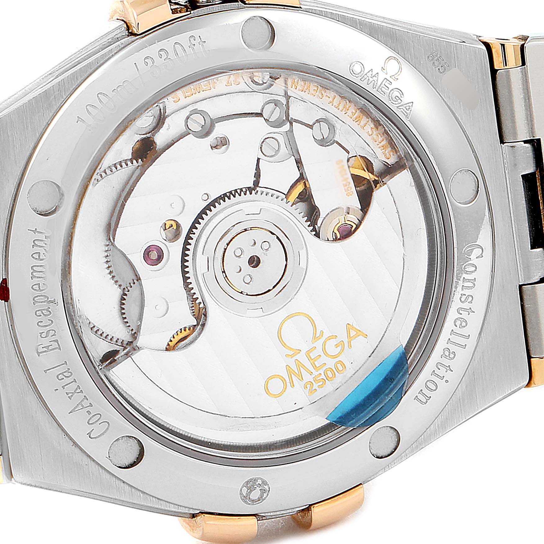 This image shows the back view of the Omega Constellation 123.25.35.20.52.001 Men's Stainless Steel Silver Dial 123.25.35.20.52.001 Men's Stainless Steel Silver Dial watch, highlighting the movement and Co-Axial escapement.