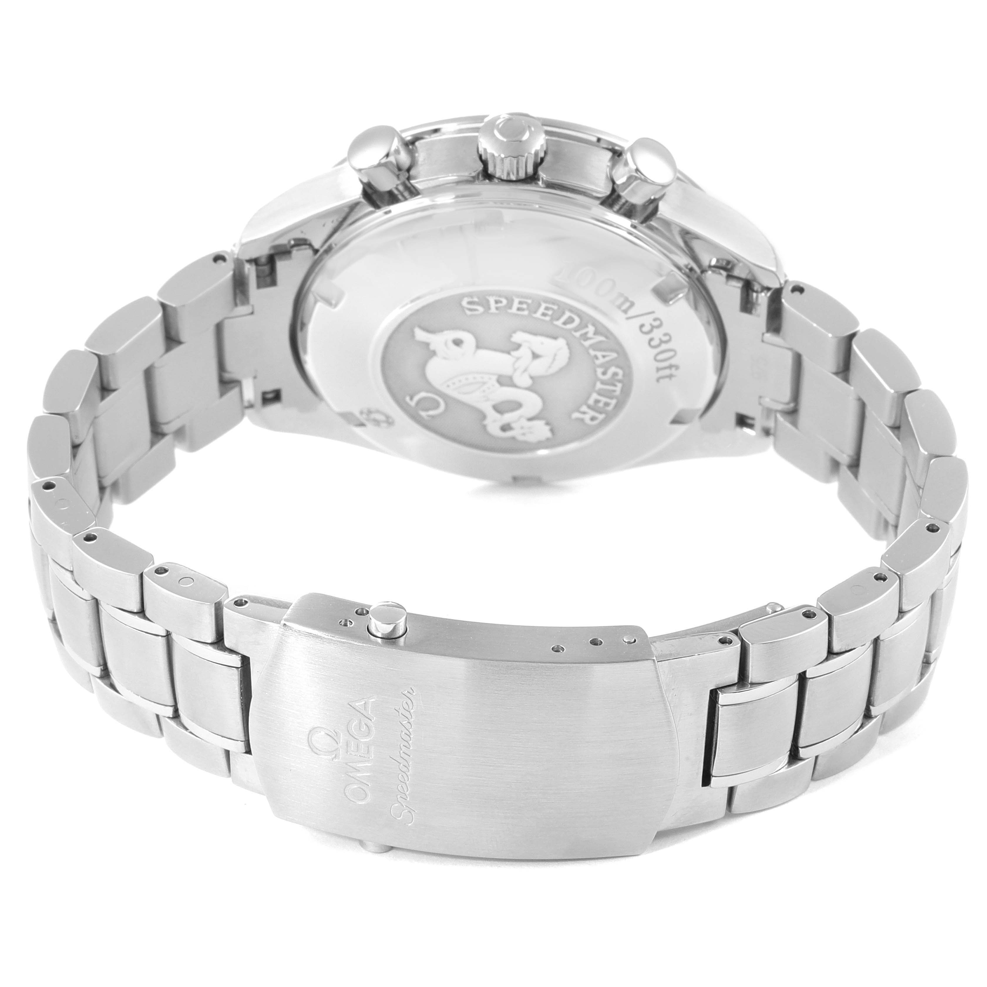 The image shows the back and clasp of the Omega Speedmaster 3210.50.00 Men's Stainless Steel Black Dial 3210.50.00 Men's Stainless Steel Black Dial watch, highlighting its stainless steel bracelet and engraved case back.