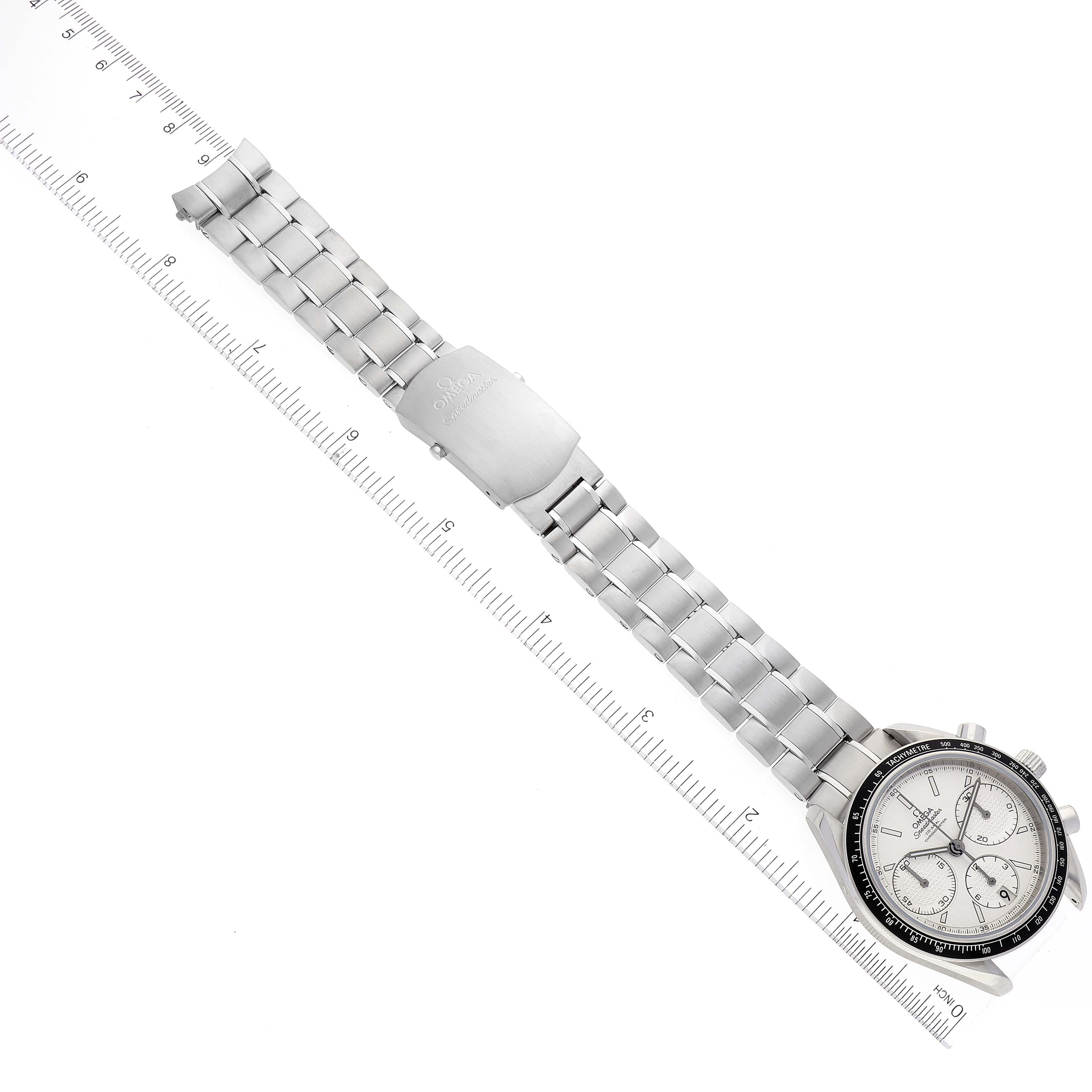 The image shows an Omega Speedmaster 326.30.40.50.02.001 Men's Stainless Steel Silver Dial 326.30.40.50.02.001 Men's Stainless Steel Silver Dial watch laid flat, displaying the full face, buttons, and bracelet, accompanied by a ruler for scale.