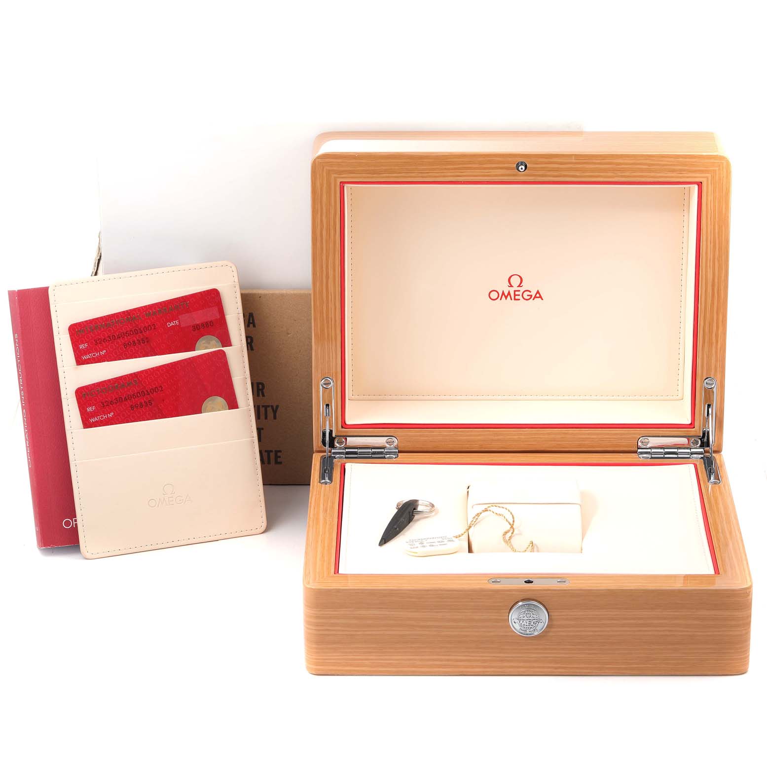 The Omega Speedmaster 326.30.40.50.01.002 Men
s Stainless Steel Black Dial 326.30.40.50.01.002 Men
s Stainless Steel Black Dial watch accessories include the opened wooden box, a user manual, warranty cards, and a magnifying glass.