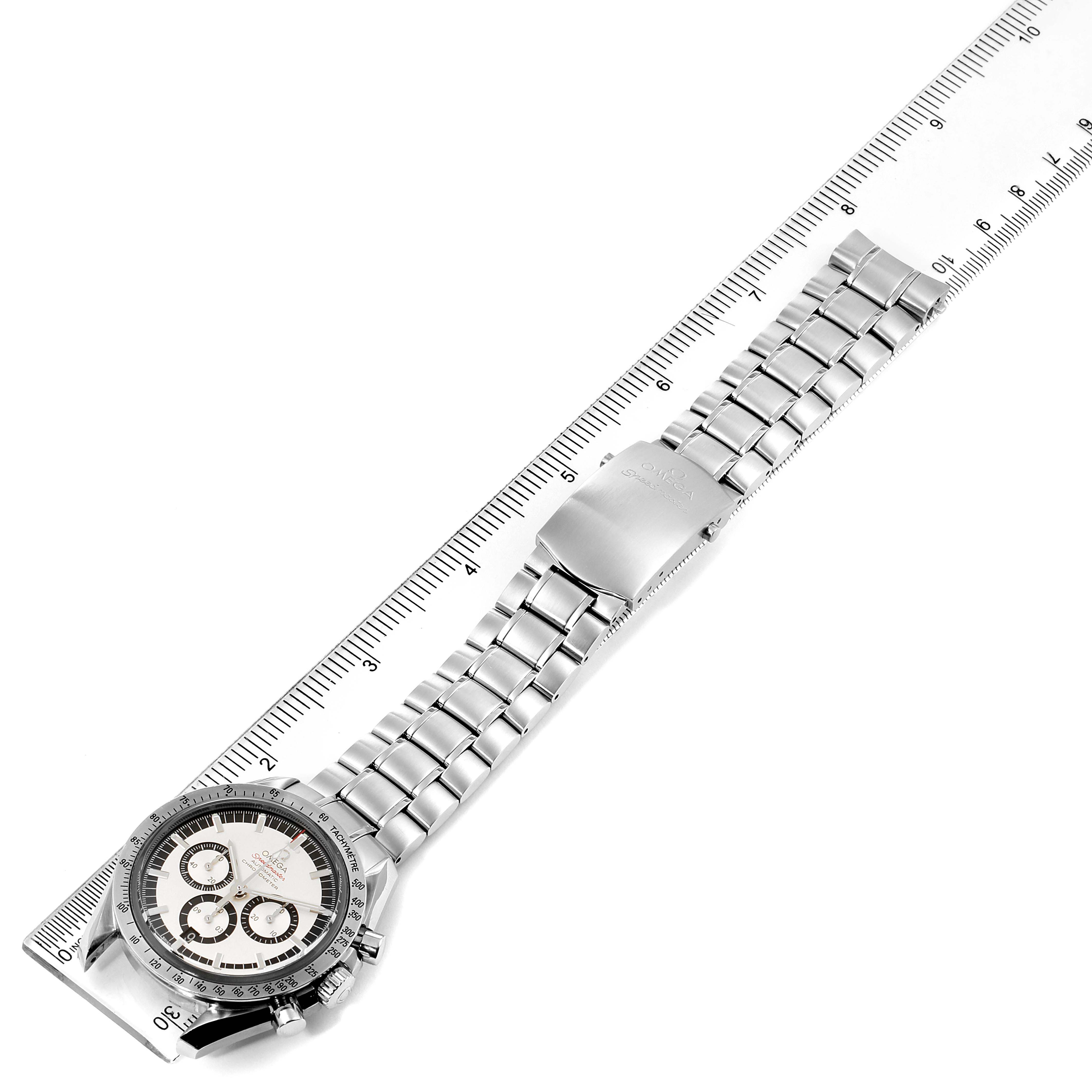 The Omega Speedmaster 3506.31.00 Men's Stainless Steel Silver Dial 3506.31.00 Men's Stainless Steel Silver Dial watch is shown from a top-down angle with its full length alongside a ruler for size reference.
