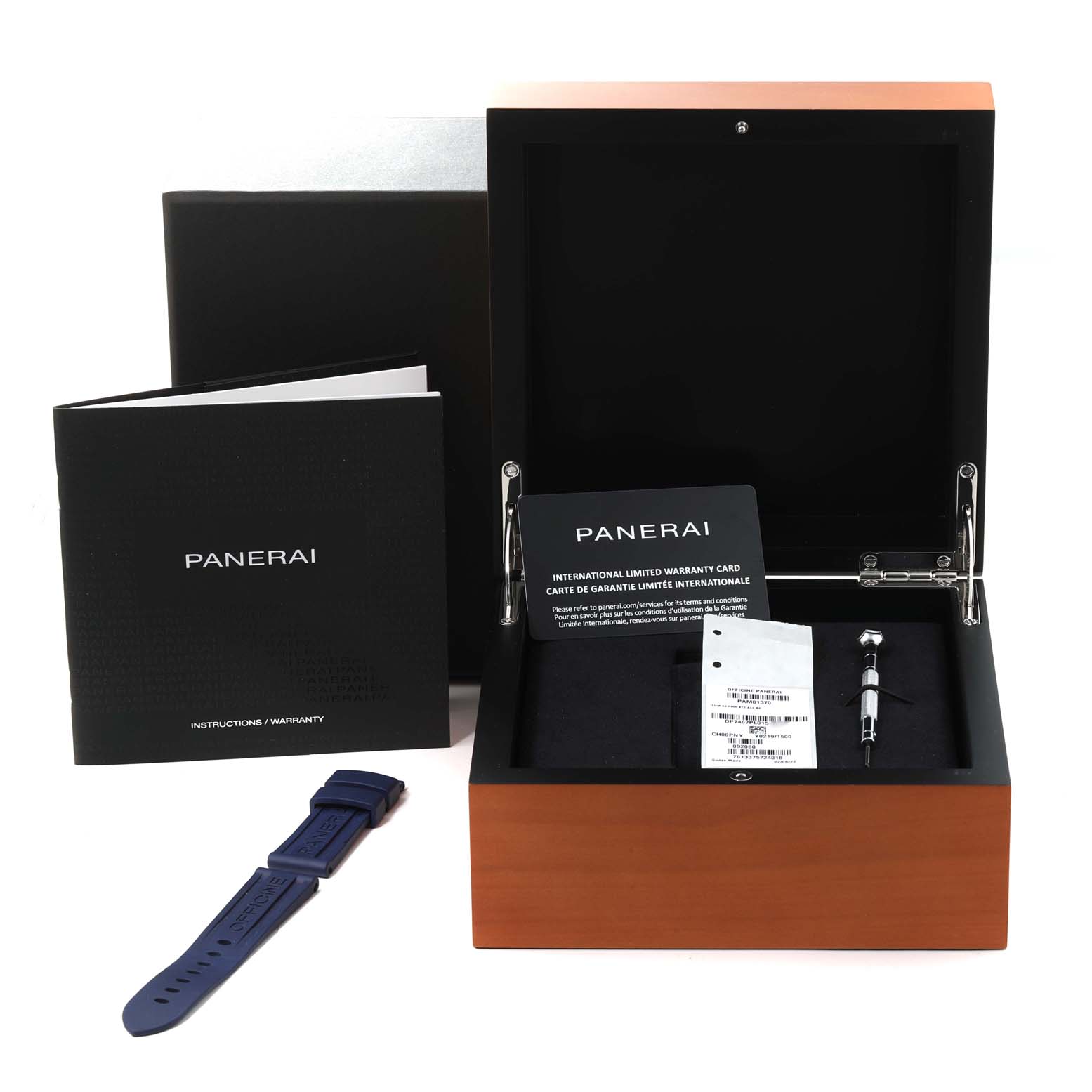The image shows a Panerai Luminor PAM01370 Men's Stainless Steel Blue Dial PAM01370 Men's Stainless Steel Blue Dial box, warranty card, instructions, a blue strap, and a tool for adjustments.