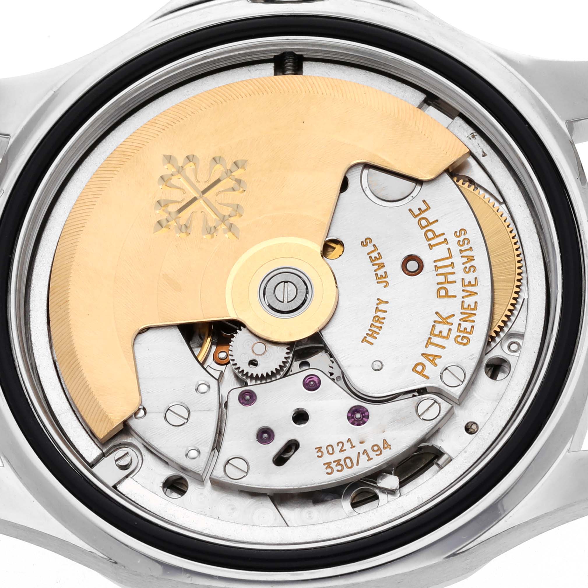 The image shows the back view of a Patek Philippe Aquanaut 5066A Men's Stainless Steel Black Dial 5066A Men's Stainless Steel Black Dial watch, highlighting its intricate movement and rotor.