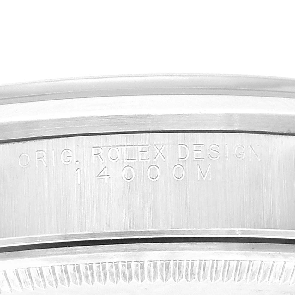 This image shows a close-up of the side of the bezel and case of a Rolex Air-King 14000 Men's Stainless Steel Blue Dial 14000 Men's Stainless Steel Blue Dial watch, highlighting the engraved model number "14000M".