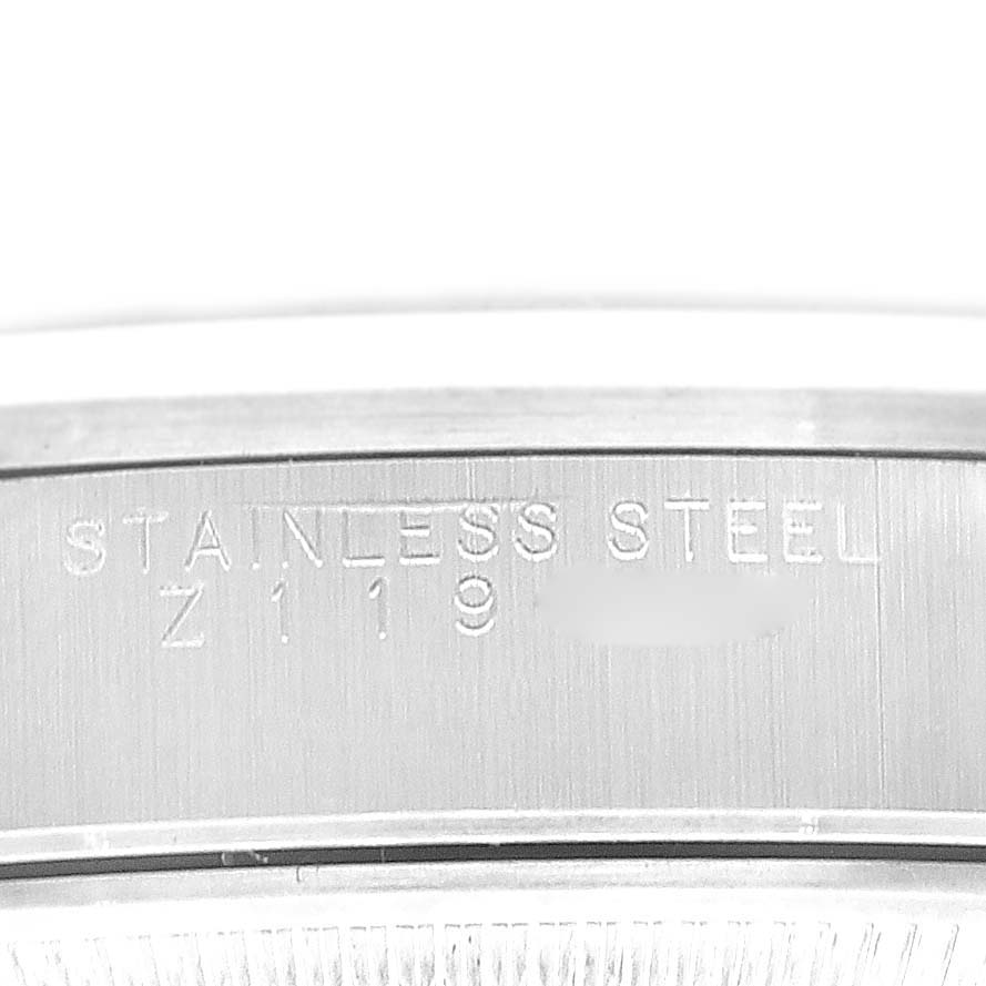 The image shows a close-up of the engraved text on the stainless steel case of a Rolex Air-King 14000 Men's Stainless Steel Blue Dial 14000 Men's Stainless Steel Blue Dial watch.