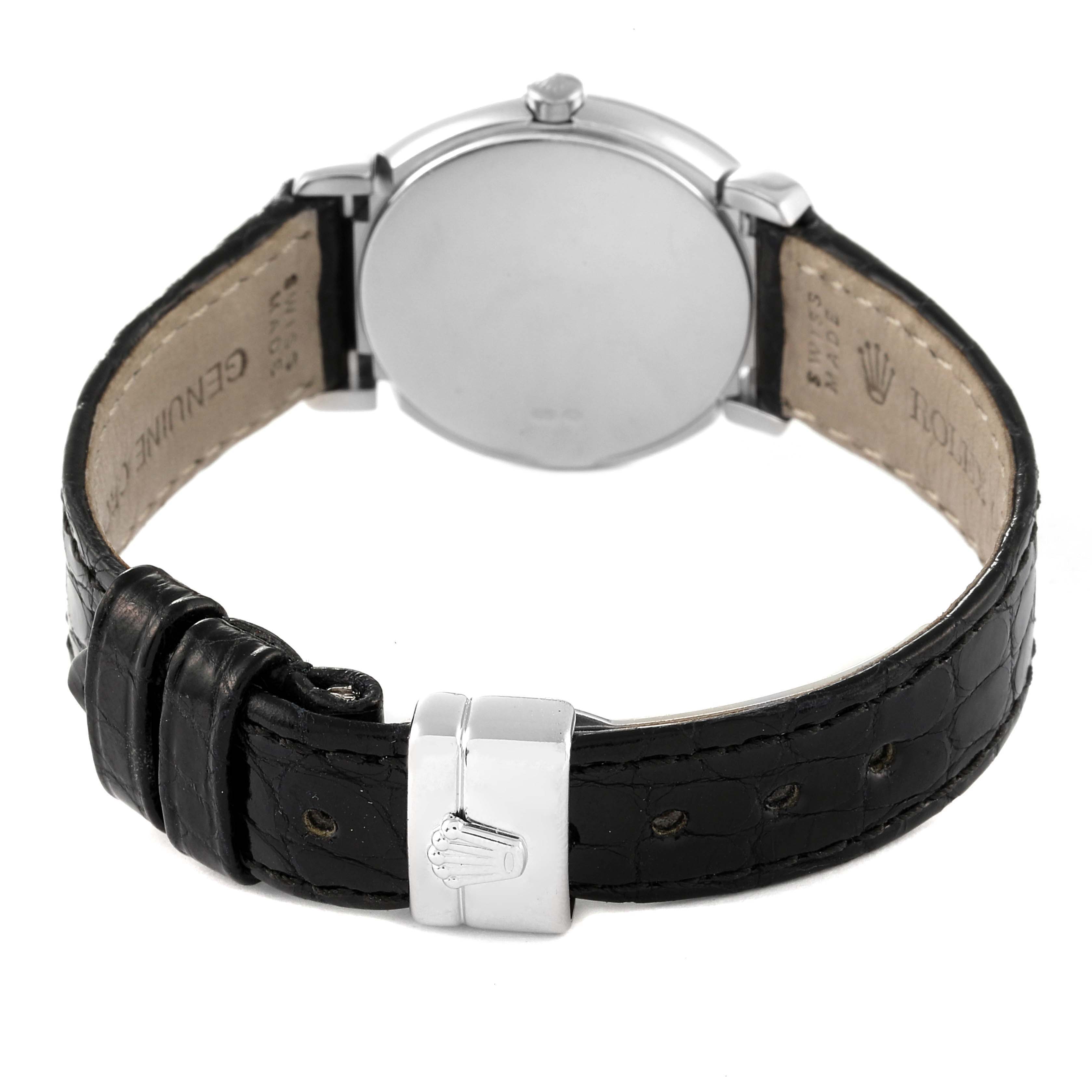 This is a rear view of a Rolex Cellini 6673 Women's White Gold Silver Dial 6673 Women's White Gold Silver Dial watch, showing the back of the case and the black leather strap with the Rolex clasp.